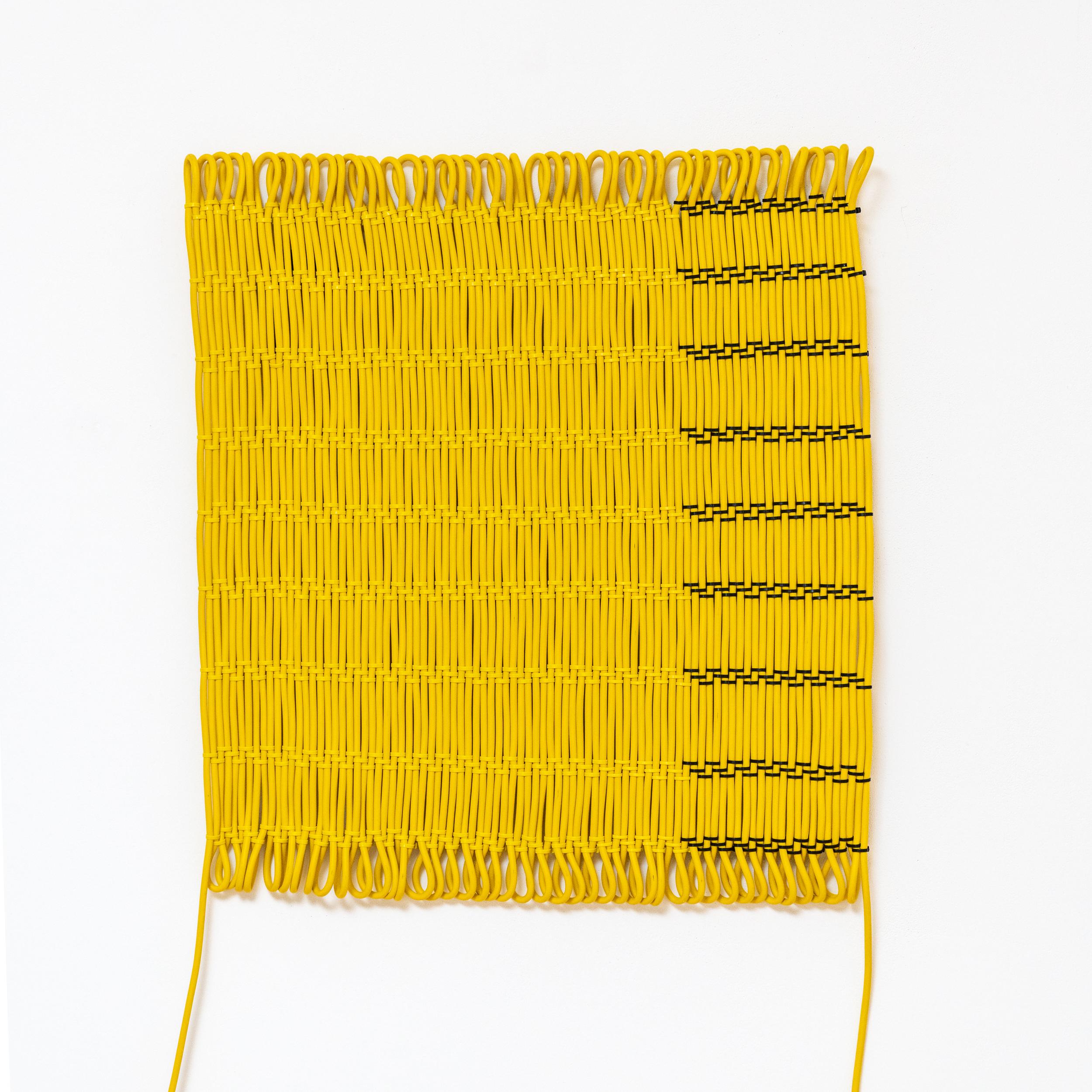 100 Meter Cable Wall rug by Tino Seubert
Dimensions: W 79 x L 102 cm or W 64 x L 130 cm (˜ 0.83 m2 surface).
Materials: PVC electricity cable, cable clips, country specific plug and socket.
Cable colours: black, yellow, orange, blue. 

Tino