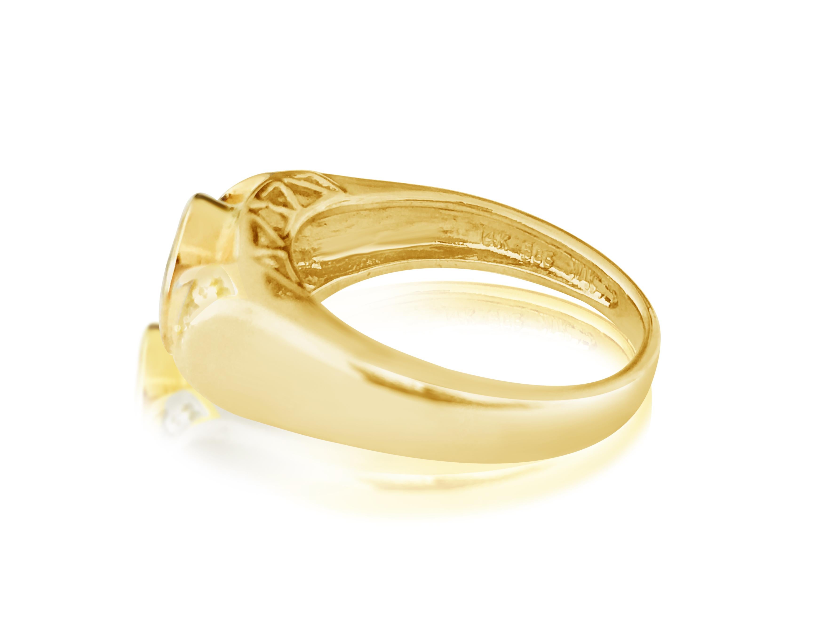 Radiate elegance with this vintage ring crafted from 14kt yellow gold, featuring a 1.25 carat natural earth-mined emerald set in a bezel setting, complemented by 0.12 carats of round-cut diamonds with VS clarity and F color. The combination of