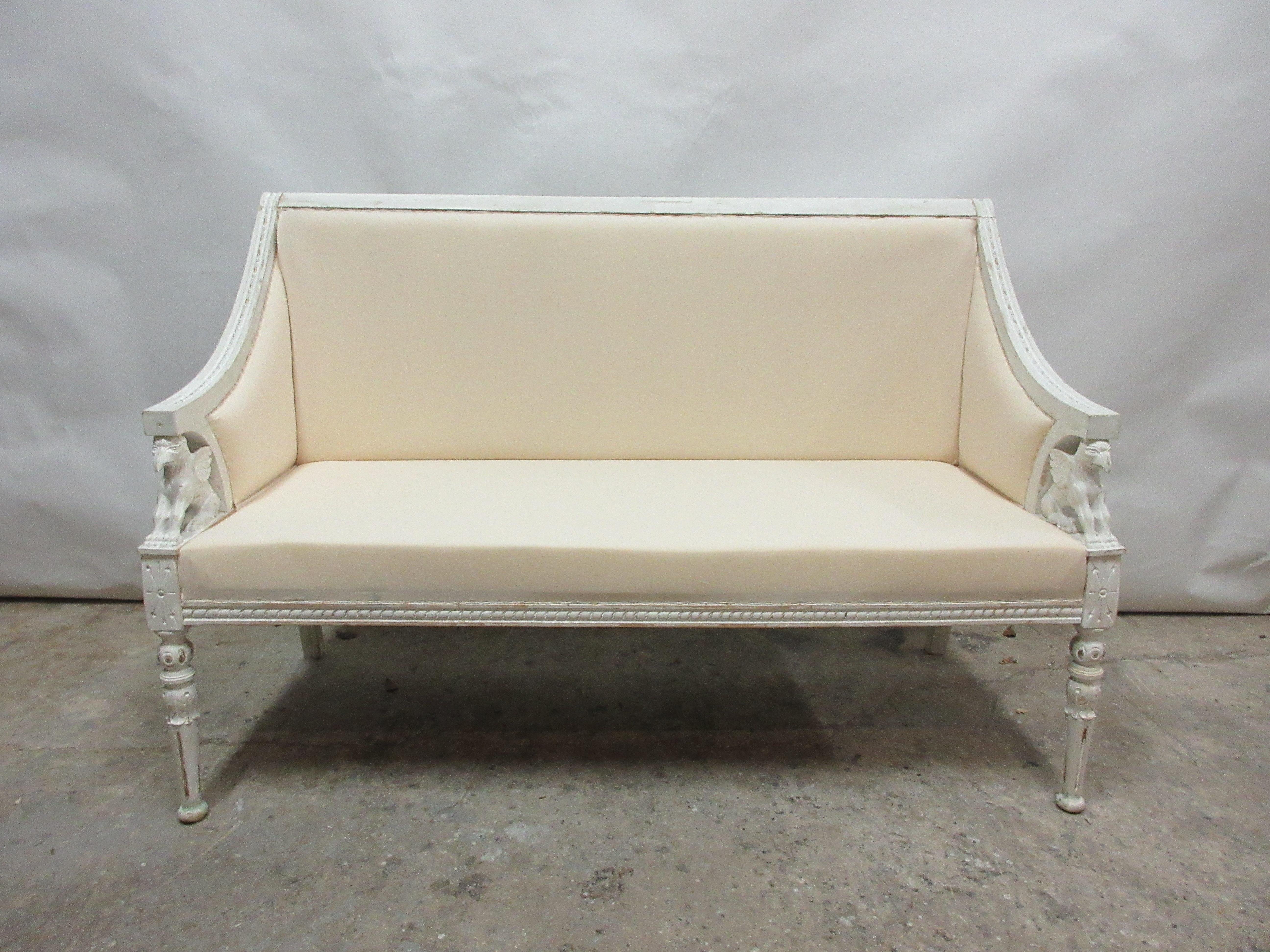 This is a 100% original finish Swedish sphinx settee, the seating has been restored and recovered in muslin.