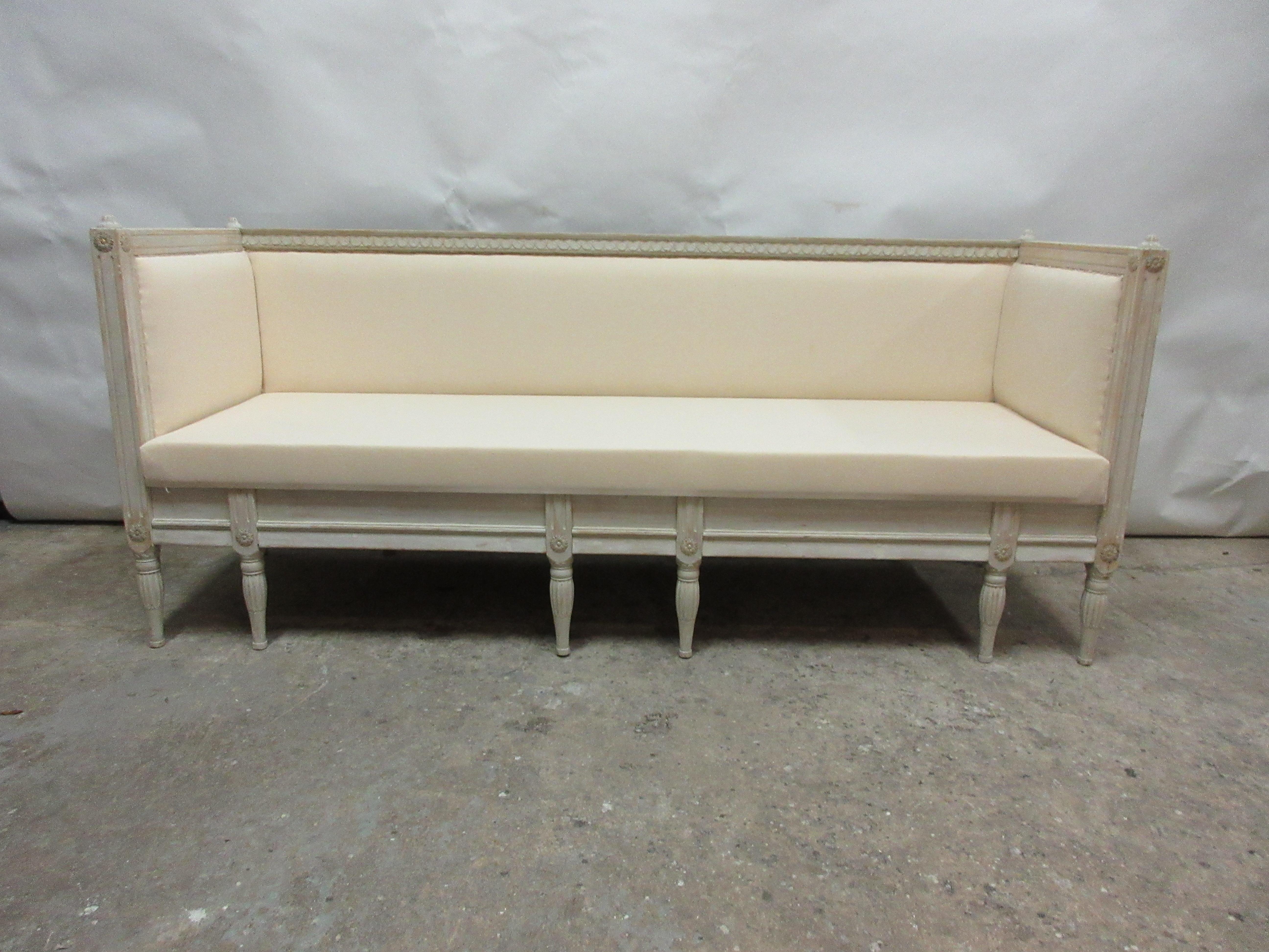 This is a 100% original painted Swedish Gustavian sofa. Seating restored and recovered in muslin.