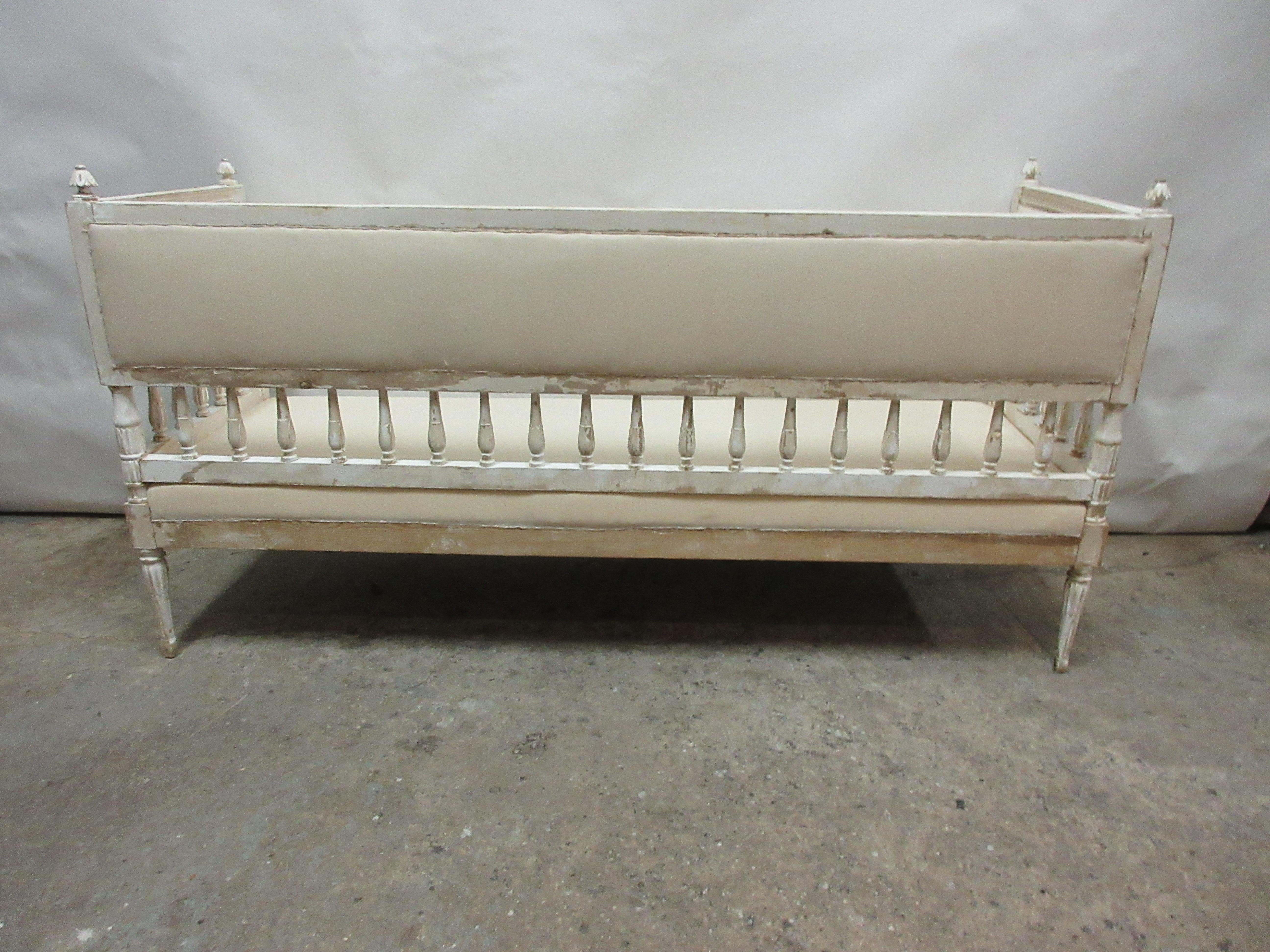 This is a 100% original painted Swedish Gustavian sofa. The seating has been restored and recovered in Muslin.