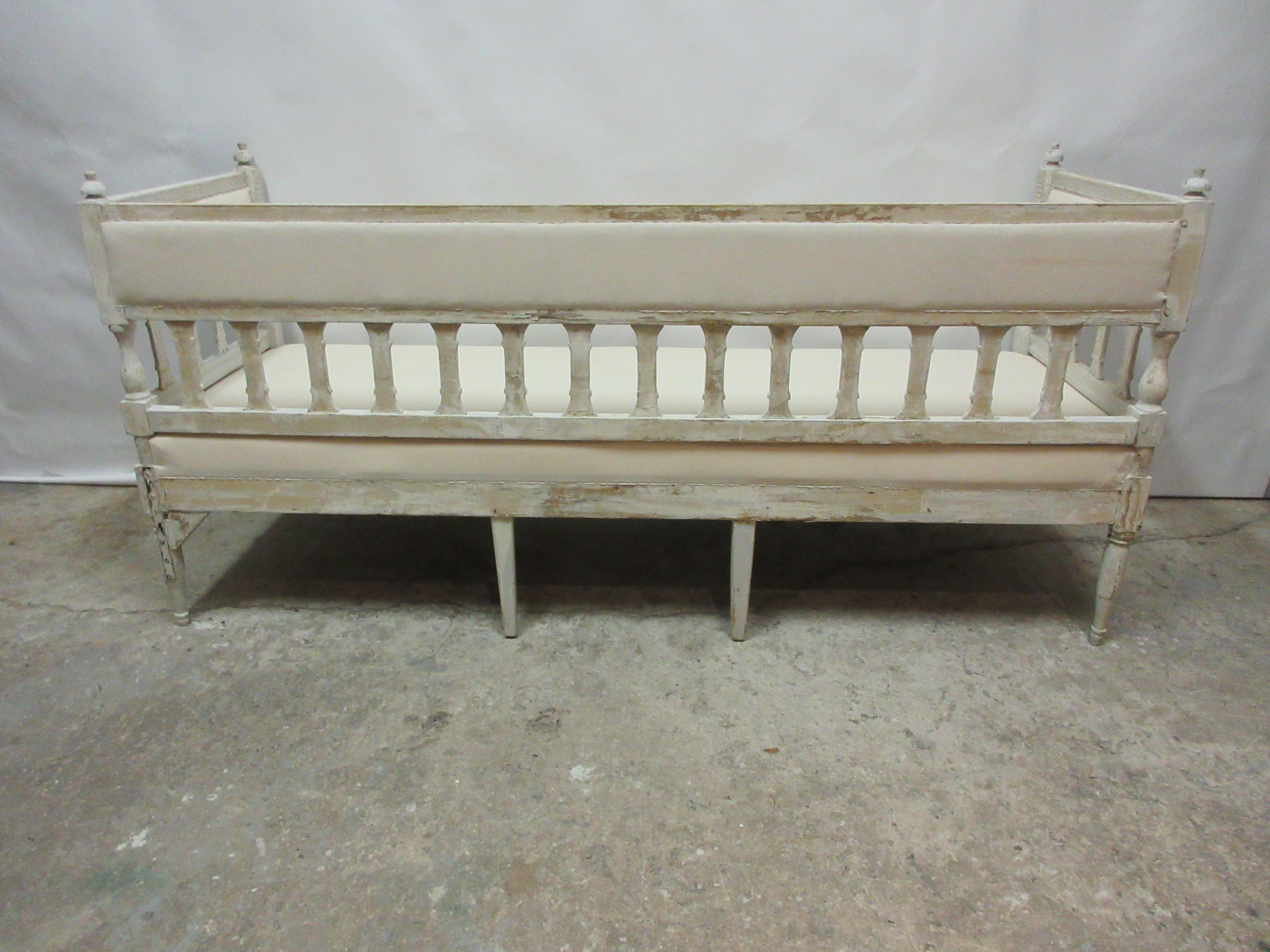 This is a 100% original painted Swedish Gustavian sofa. the seating has been restored and covered in Muslin.