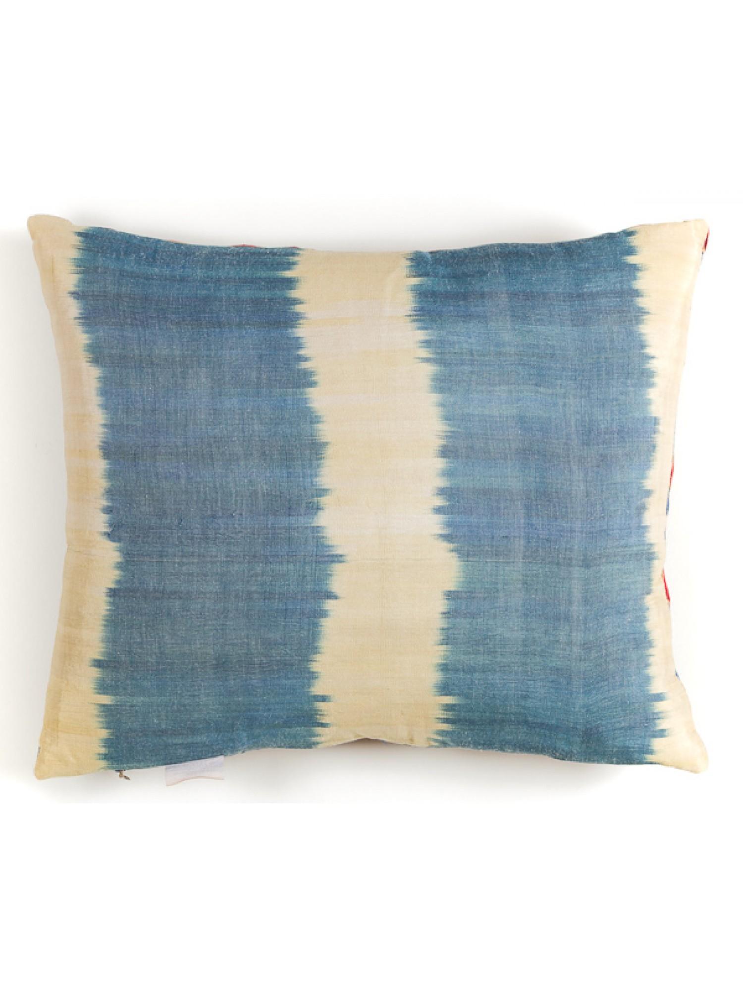 This cushion is made from all-natural materials.
Front side, the fabric of this hand-embroidered Suzani is 80% silk, 20% cotton, and the embroidery thread is 100% silk.
Back side, the ikat is %100 silk. The ikat on the back and the embroidery