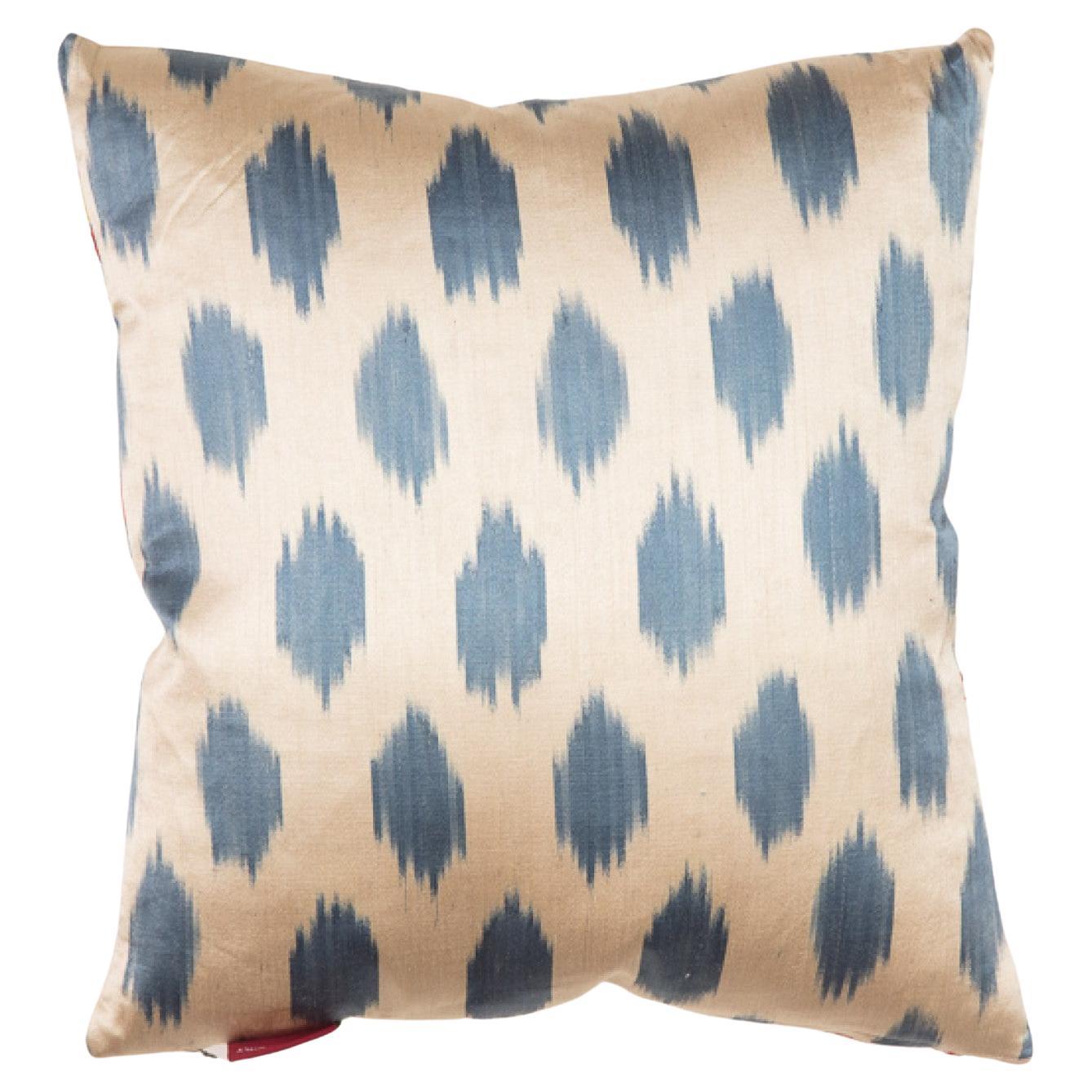 This cushion is made from all-natural materials.
Front side, the fabric of this hand-embroidered Suzani is 80% silk, 20% cotton, and the embroidery thread is 100% silk.
Back side, the ikat is %100 silk. The ikat on the back and the embroidery