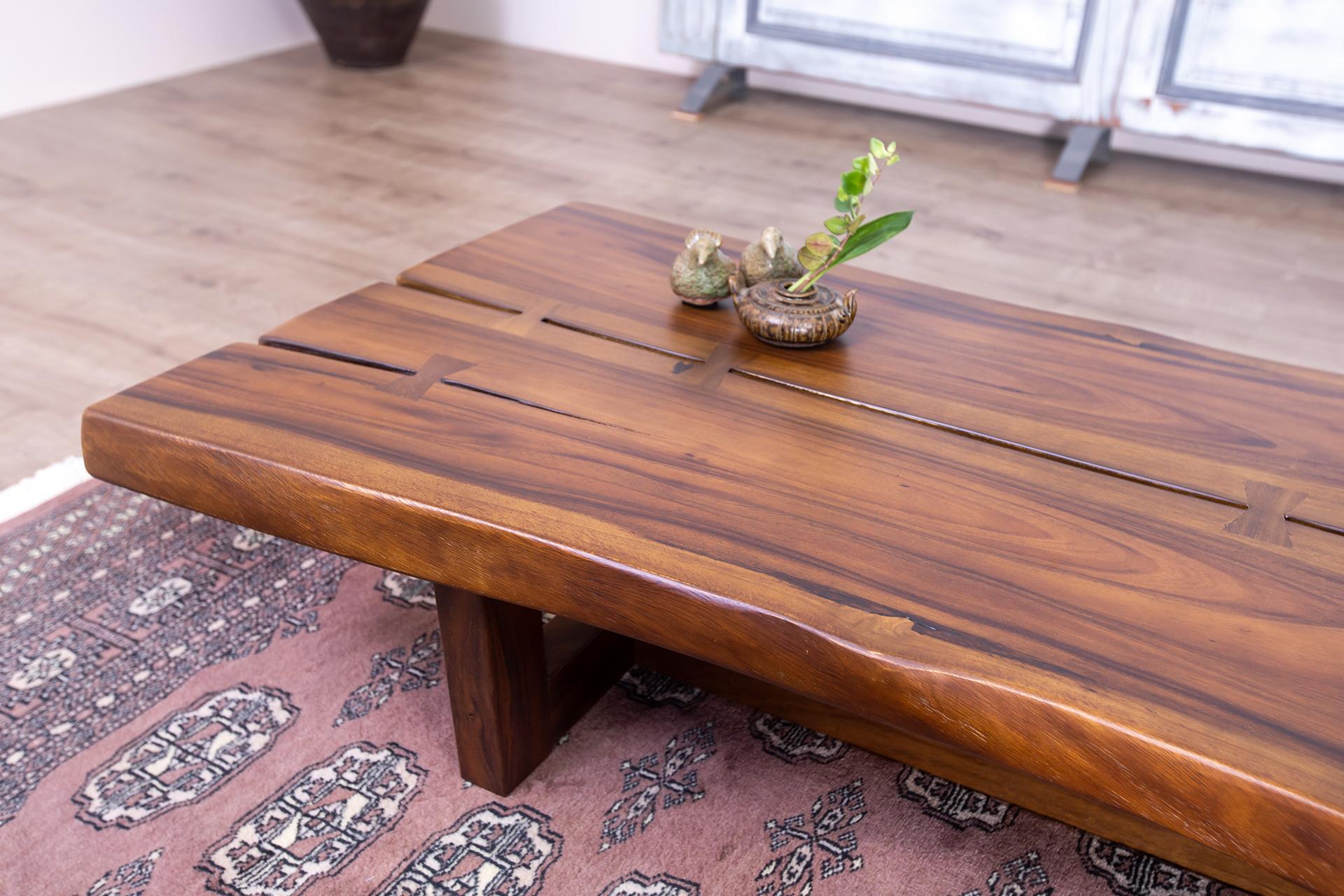 The Table Company makes only 100% solid, hardwood furniture.  We primarily use Thai/Burmese Teak, North American Red and White Oak, and old-growth Cham-Cha (Siam Acacia).  Unlike many mass-market manufacturers and retailers, our furniture is made