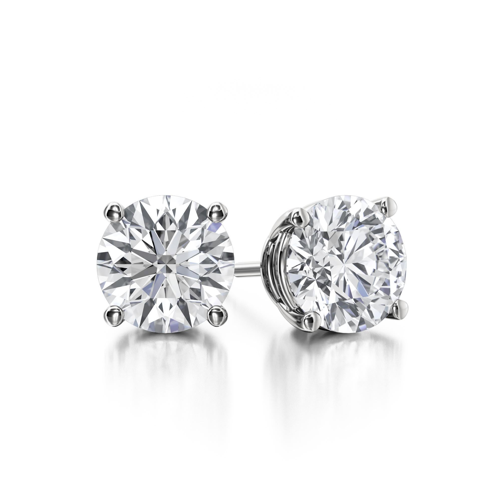 Classic Four Prong Diamond Stud Earrings, featuring:
✧ 2 natural diamonds G-H color VS1-VS2 weighing 1.00 carats 
✧ Measurements: 5.20mm*5.20mm
✧ Available in 18K White Gold
✧ Push back friction closure
✧ Free appraisal included with your purchase
✧