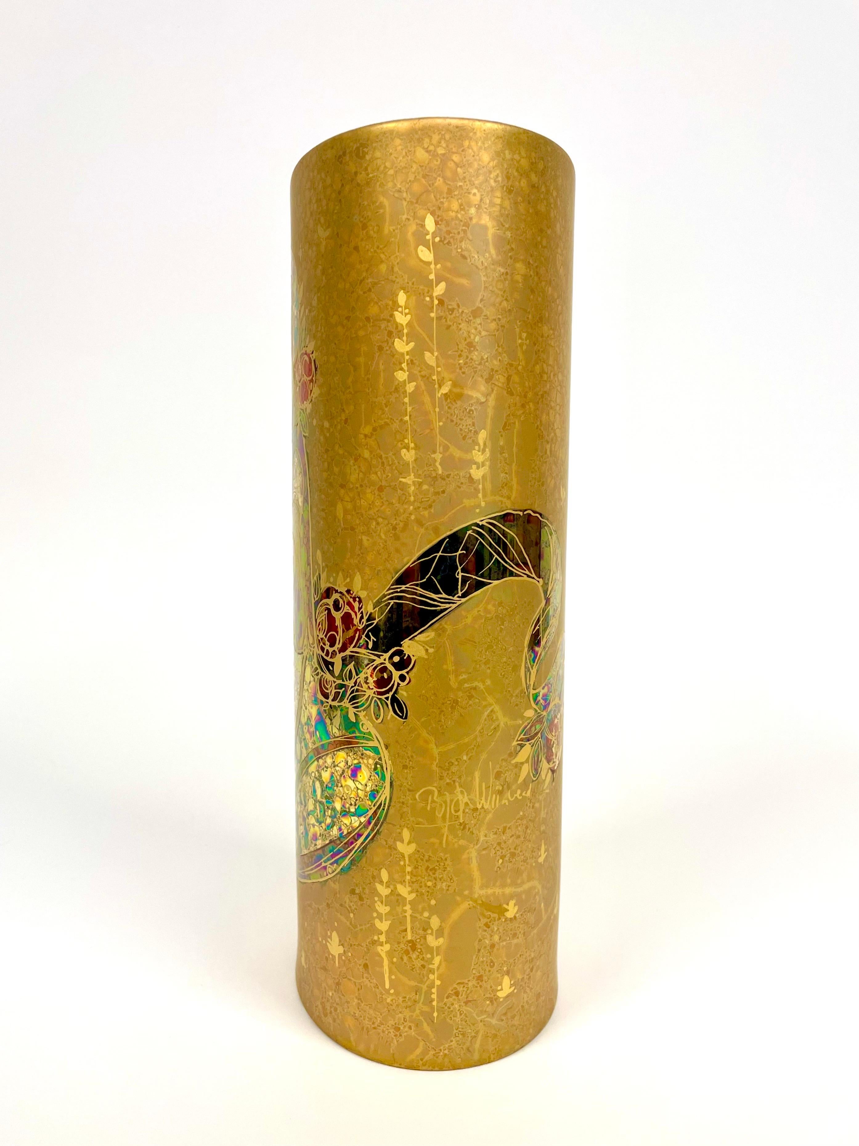 This is a tall, oval German porcelain vase from Rosenthal, designed 1979 by Bjørn Wiinbladh, Denmark for the company’s 100-years anniversary. 
It comes hand painted and partly metal gilded. 

The oval of the vase measures
12x9.5 cm and the height 28