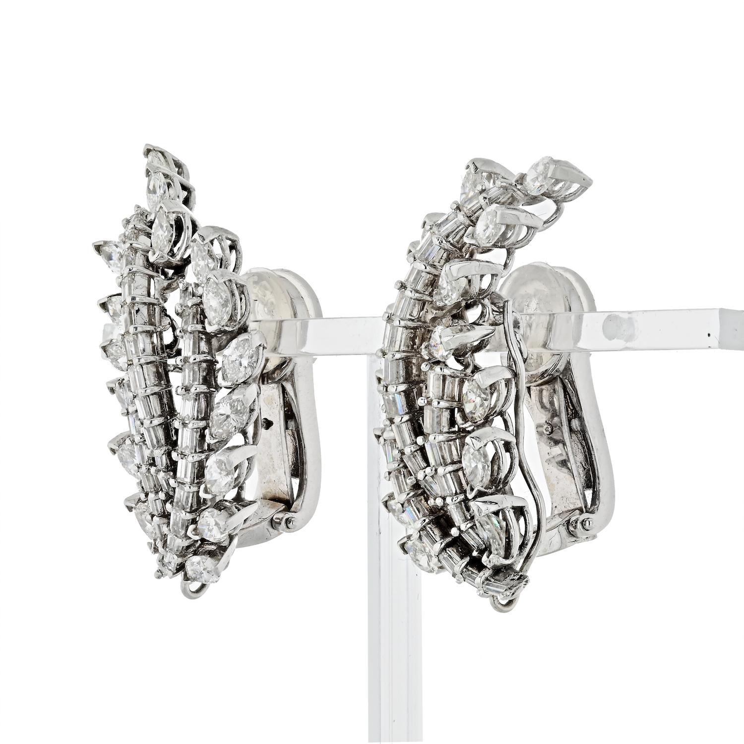 These well designed and handcrafted ear clips from ca. 1935 are beautifully shaped in the form of leaves which elegantly flow up the ear and are set with a total of 10.00cts  white baguette and marquise cut diamonds. 
Comfortable clips. 
Earring