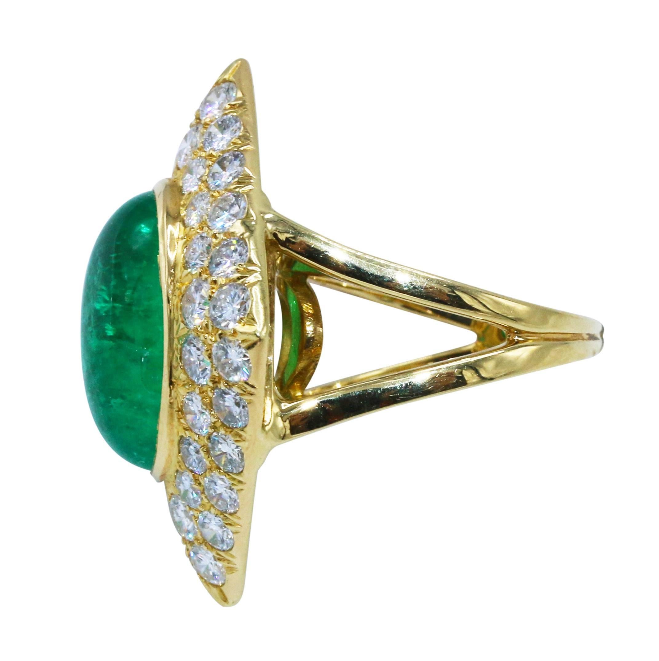 18 karat yellow gold, emerald and diamond cocktail ring, set in the center with a cabochon emerald weighing approximately 10.00 carats, within a diamond-shaped plaque set with round diamonds weighing approximately 1.20 carats, gross weight 11.3