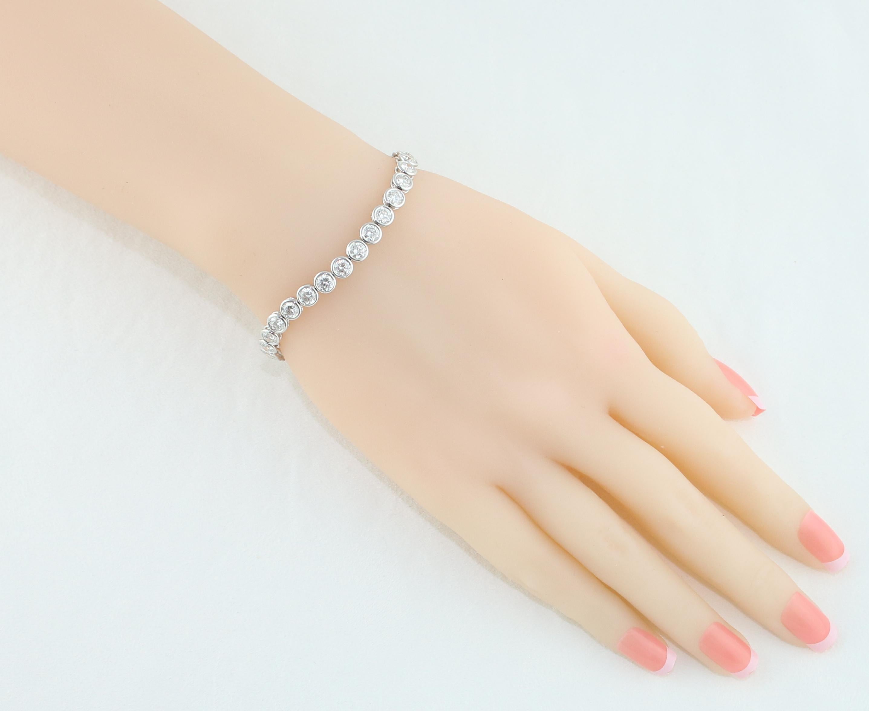 Beautiful & Classic Bezel Tennis Bracelet.
The bracelet is 18K White Gold.
There are 10.00 Carats in Diamonds F/G VS.
There are 34 stones, each stone is 0.30 Carat.
The bracelet is 7.25