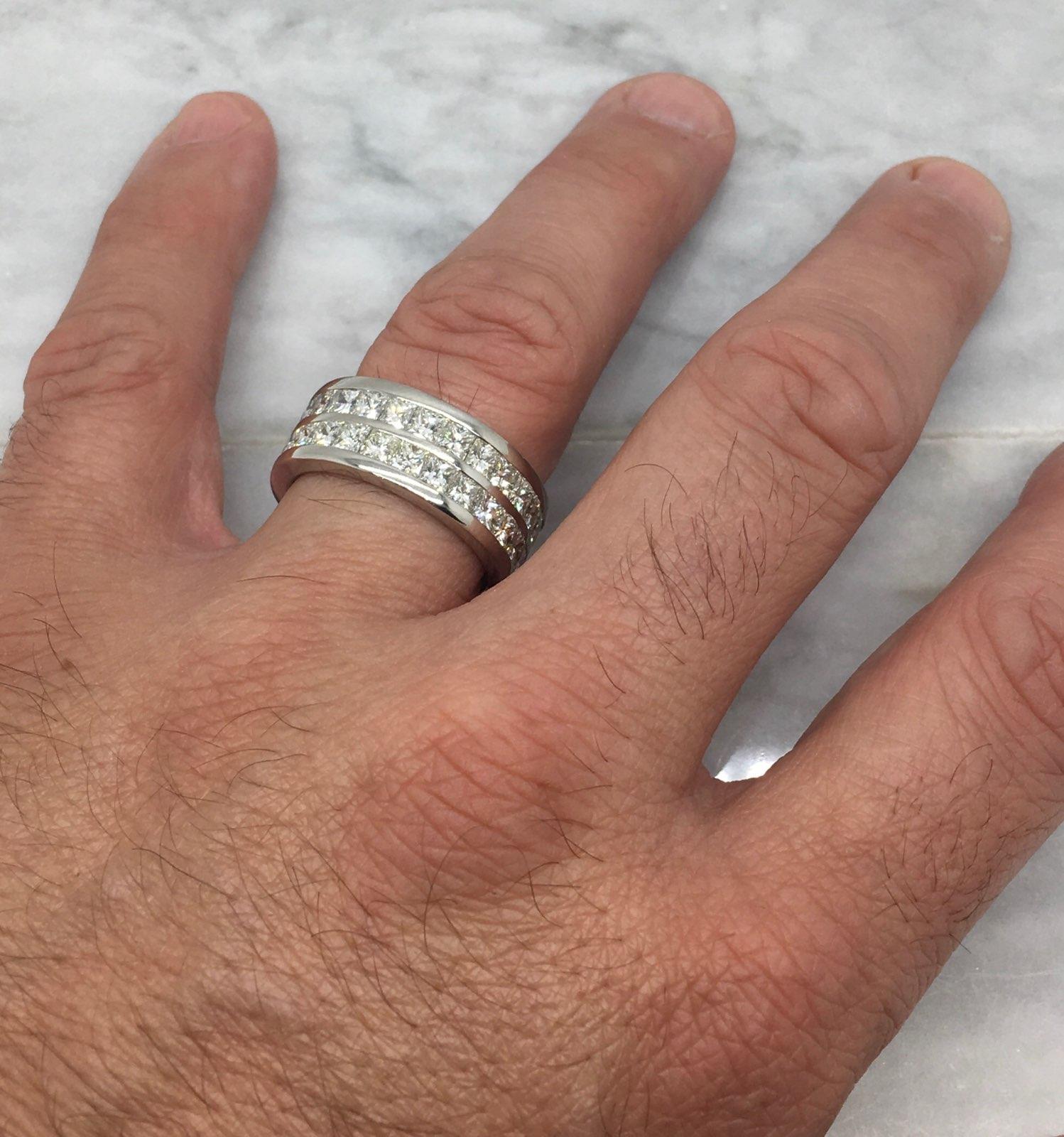This stunning two row eternity diamond band features approximately 10.00CTW of Princess Cut Diamonds. 

Diamond Carat Weight: Approximately 10.00CTW
Diamond Cut: 52 Princess Cut Diamonds
Color: Average G-K
Clarity: Average VS2-SI1
Metal: