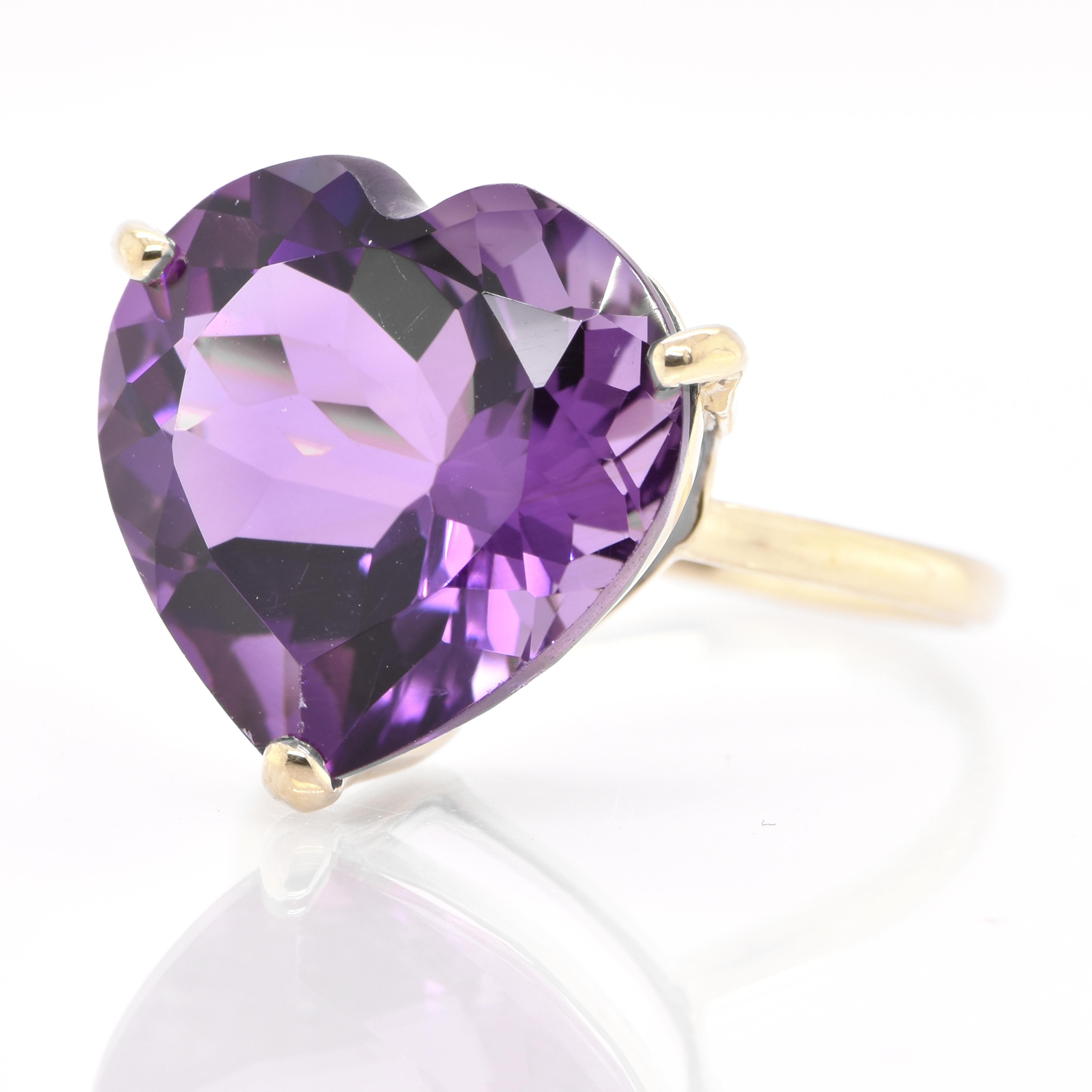 A beautiful Cocktail Ring featuring a 10.00 Carat, Natural Heart-Cut Amethyst set in 18 Karat Yellow Gold. Amethyst has been the most-prized quartz for centuries. The ancient Greeks thought it had magical and medicinal properties. Fine amethysts