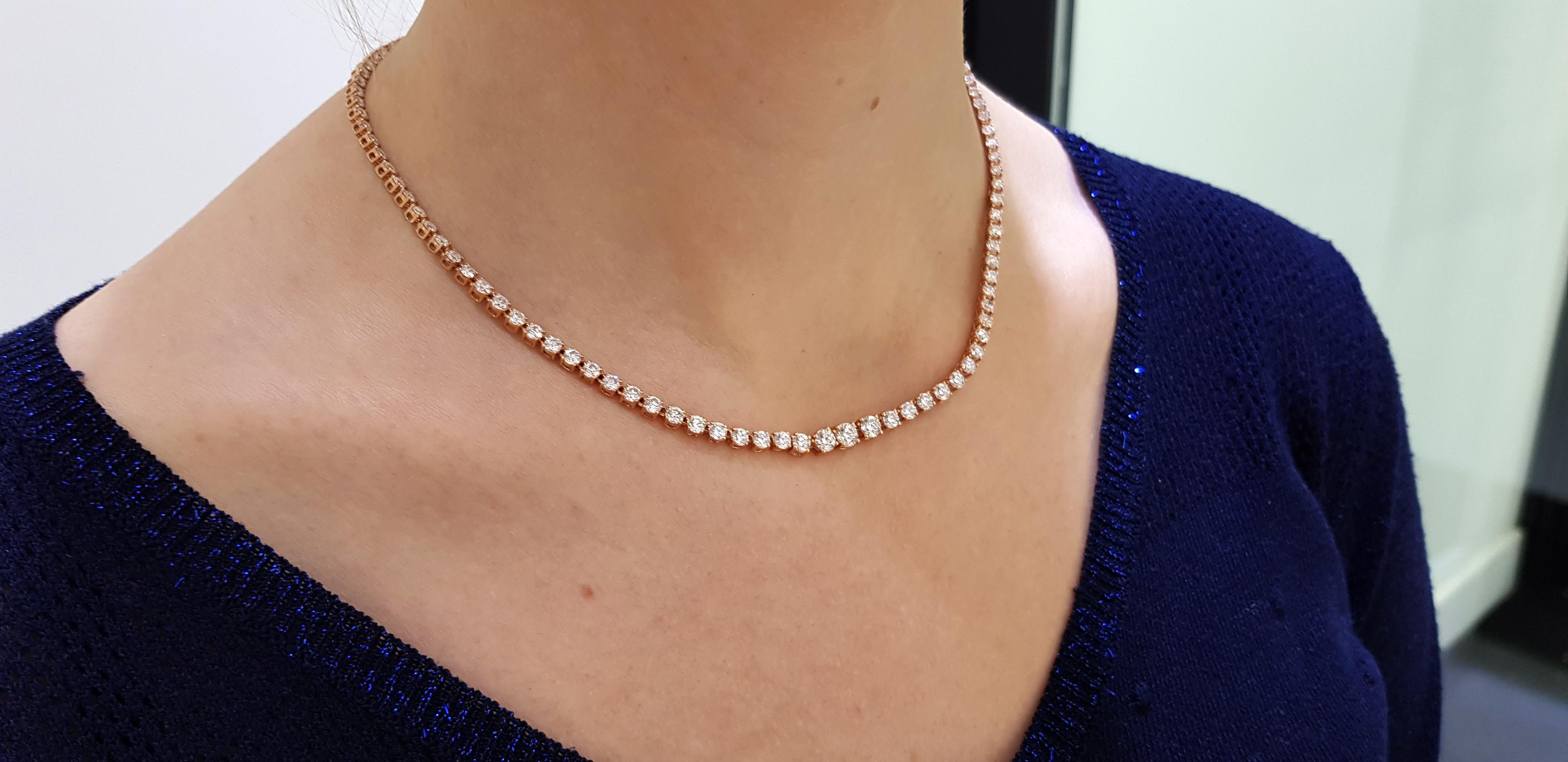 This stunning and impressive Riviera Necklace features substantial Diamond weight of 10.00 Carats in beautifully graduated Round Brilliant Cut gems with a sparkly white color G/H clarity SI1. Each stone has a four claw setting with open gallery and