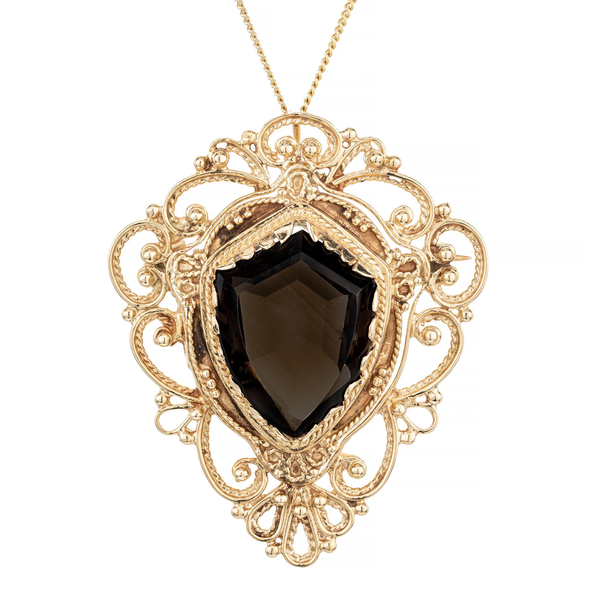 Vintage 1950's smoky quartz yellow gold brooch pendant necklace. 10.00ct shield shape smoky Quartz mounted in 14k yellow gold highly detailed Victorian style setting. This unique gem can be worn two ways. separately as a brooch or as a pendant with