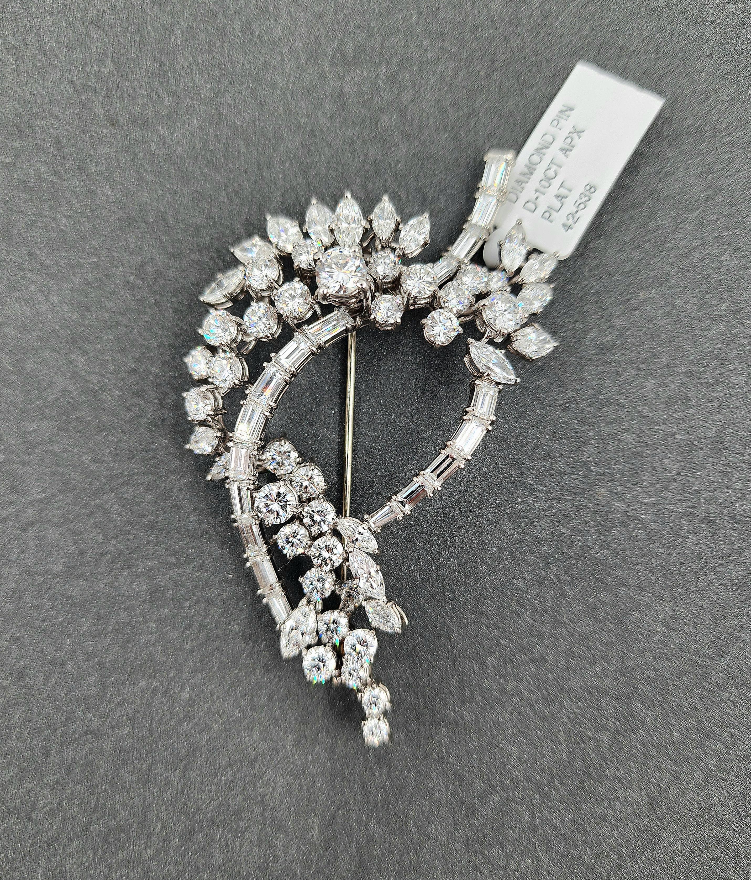 A captivating antique brooch showcasing a brilliant combination of round, marquise, and baguette-cut diamonds totaling approximately 10.00 ct. The diamonds are E/F in color and VS1/VS2 in clarity, meticulously set in platinum to highlight their