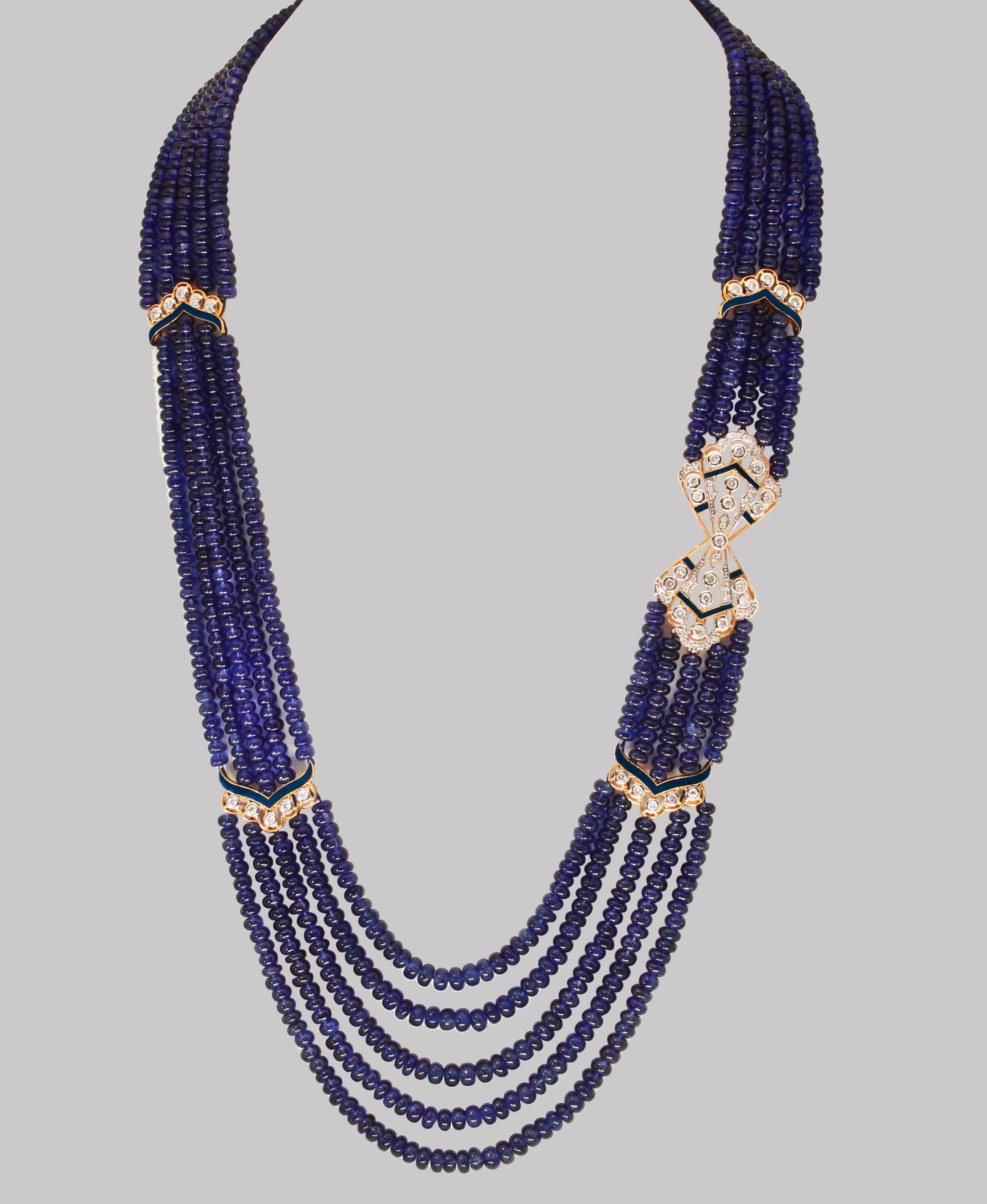 Smooth 1000 Ct Natural Tanzanite Bead Five Strand Necklace With Diamond 14 Karat Yellow  Gold
All natural beads , no color enhancement
Opera Length
Gold clasp is such that you can adjust the length of the necklace  
5 layers of Natural  Beads
These