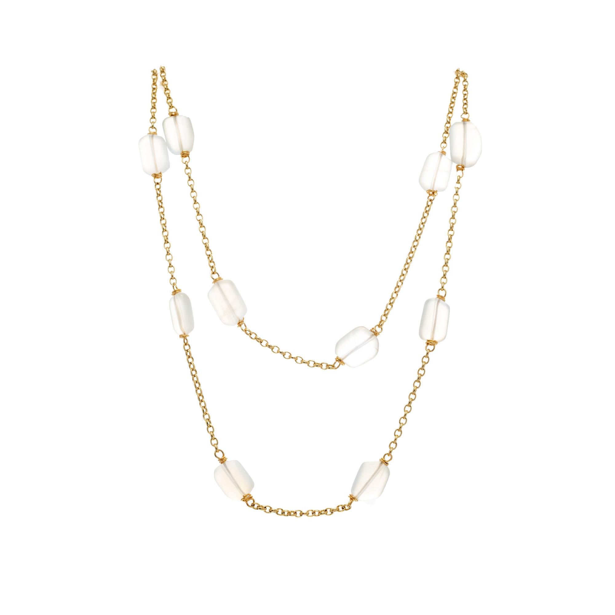 Solid 18k yellow gold link chain with 15 tumbled moonstones. Can be worn once or twice around the neck. 

15 elongated rectangular shaped white moonstone beads, approx. 100.00
18k yellow gold 
Stamped: 750 18k Italy
47.2 grams
Chain: 36 Inches 

