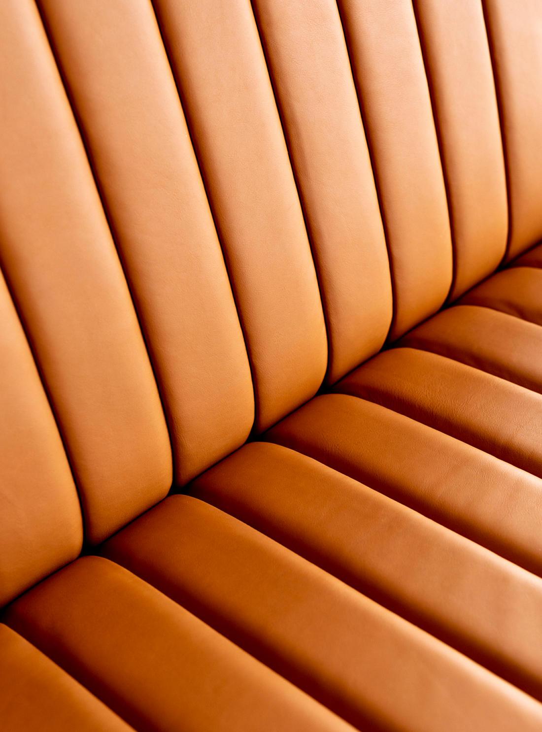 Bambi 56/1 / Lounge Chair
by Rastad & Relling 

Upholstered 3-seater leather sofa with fluted padding and a solid walnut and stainless steel base. Available in three different leather types.

Made in Norway.

Dimensions: Inches (D x W x H)
29.92