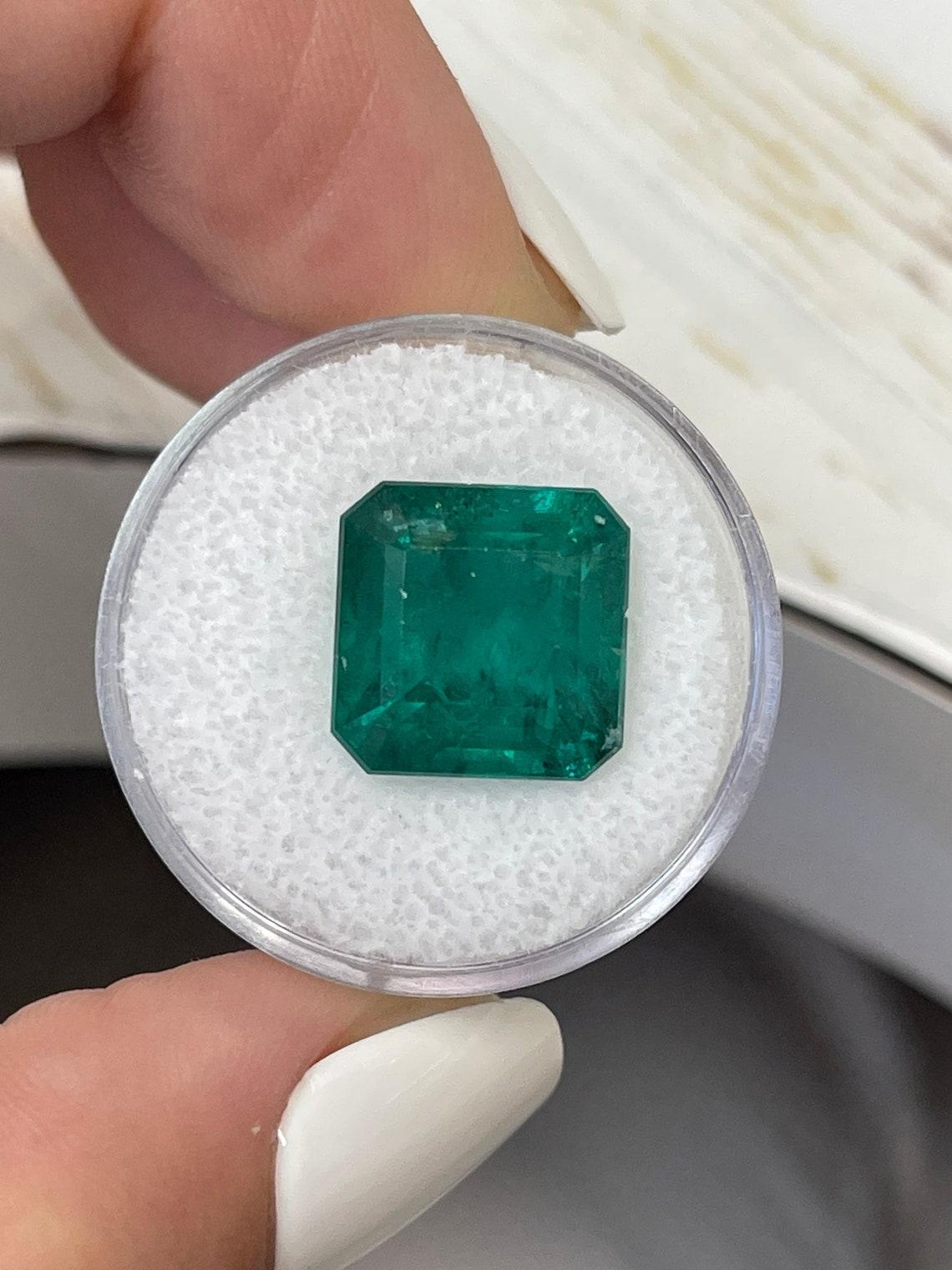 Stone: Emerald
Weight: 10.01-carats
Shape: Asscher Cut
Clarity: Transparent
Luster: Excellent
Color: Vivid Dark Green
Measurements: 12.56mm x 12.47mm x 8.91mm
Geographic Origin: Zambia
Treatment: Natural, Oiling

Comments: Due to their growth