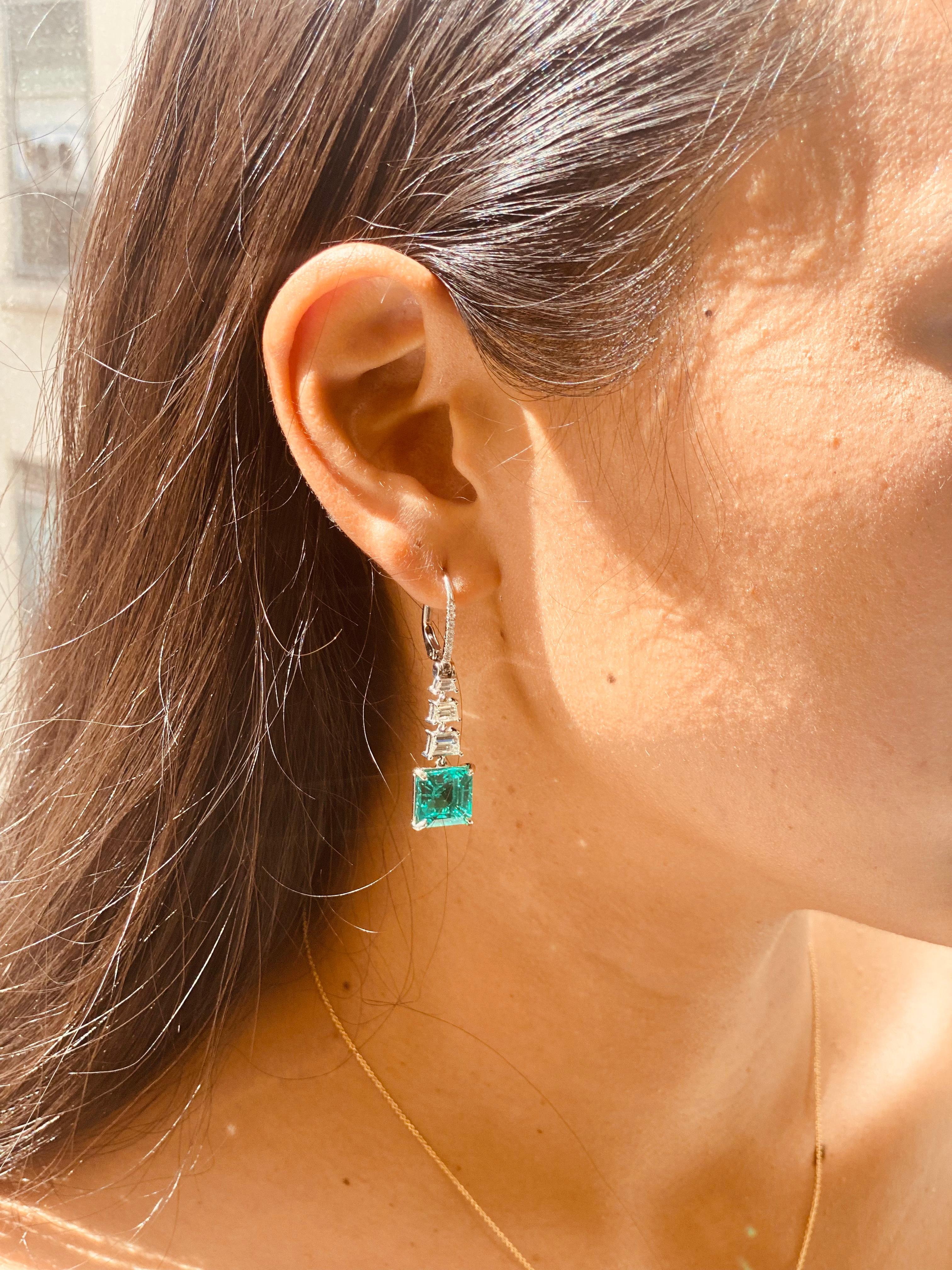Diamond Drop Earrings with Square Emerald Cut Emeralds. 
Emerald Certificate available

Details: 
10.02 Carats of paired natural Zambian Emerald in square emerald cut. 
3.2 ct diamond F VS clarity. 
Weight 10 grams 
Earring Dimensions -  1.75” Tall