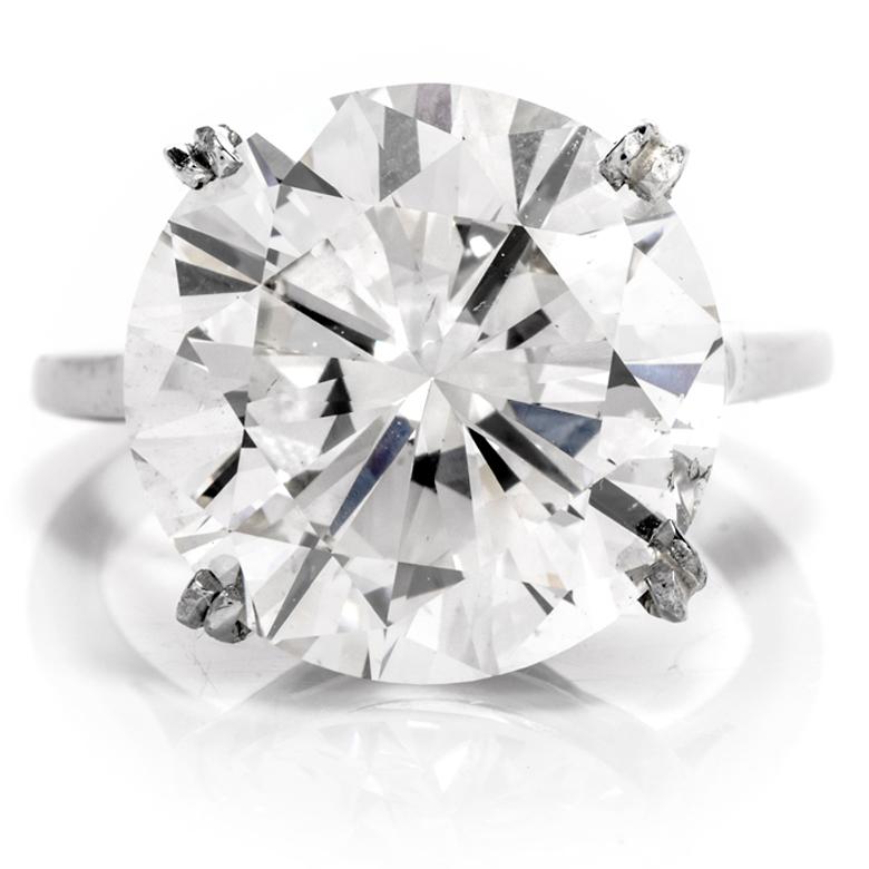 ell Her How You Really Feel with this astonishing

10.02 Carat classic and timeless Round Solitaire Engagement Ring!

This platinum mounting contains 1 round faceted diamond measuring 

13.79 x 13.94 x 8.28mm and weghing appx. 10.02 carats.

This