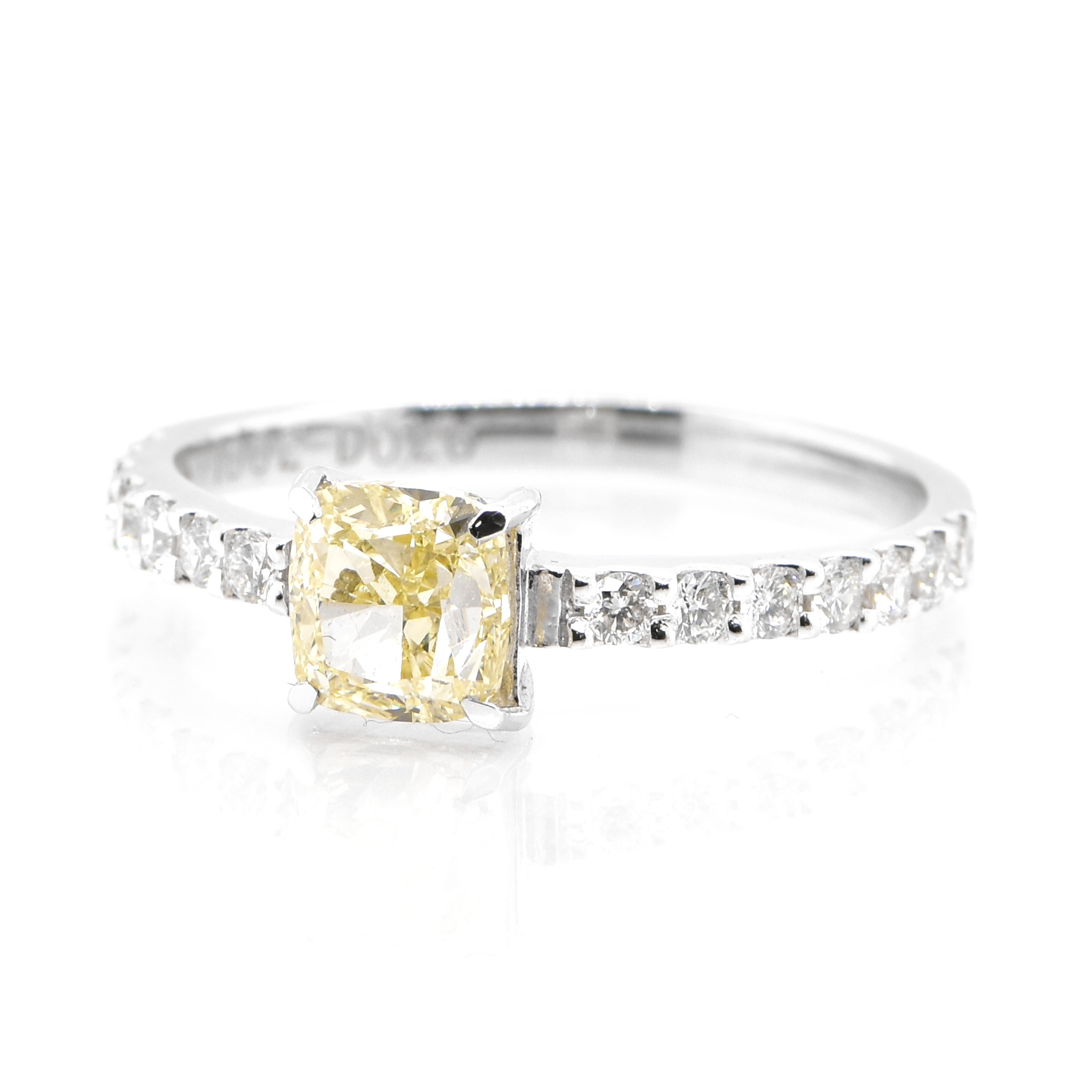 A beautiful ring featuring a CGL Certified 1.002 Carat Natural VS-1, Light Yellow Diamond and 0.26 Carat Diamond accents set in Platinum. Diamonds have been adorned and cherished throughout human history and date back to thousands of years. They are