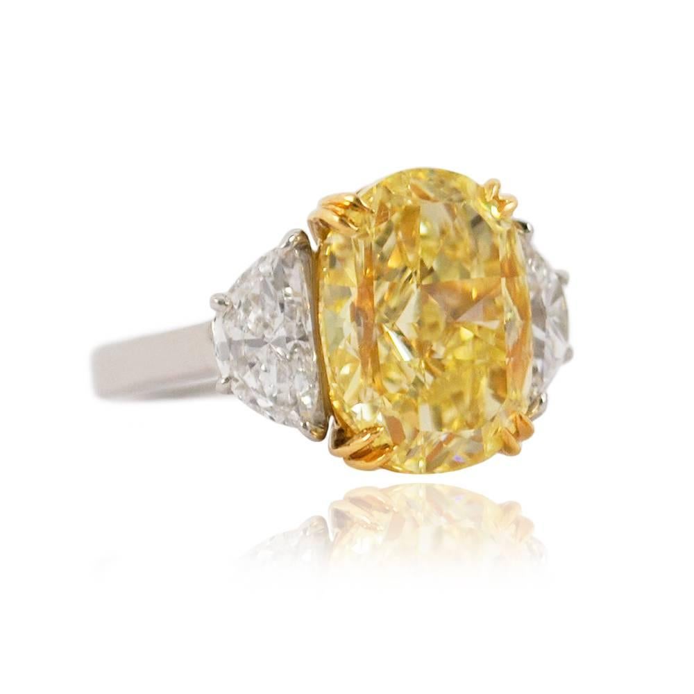 This gorgeous 10.03 carat fancy yellow diamond is like wearing a piece of sunshine! Exceptionally sparkly and with beautifully vibrant color, this is a truly magnificent piece. Graded by GIA as a fancy yellow color and VS2 clarity, the center