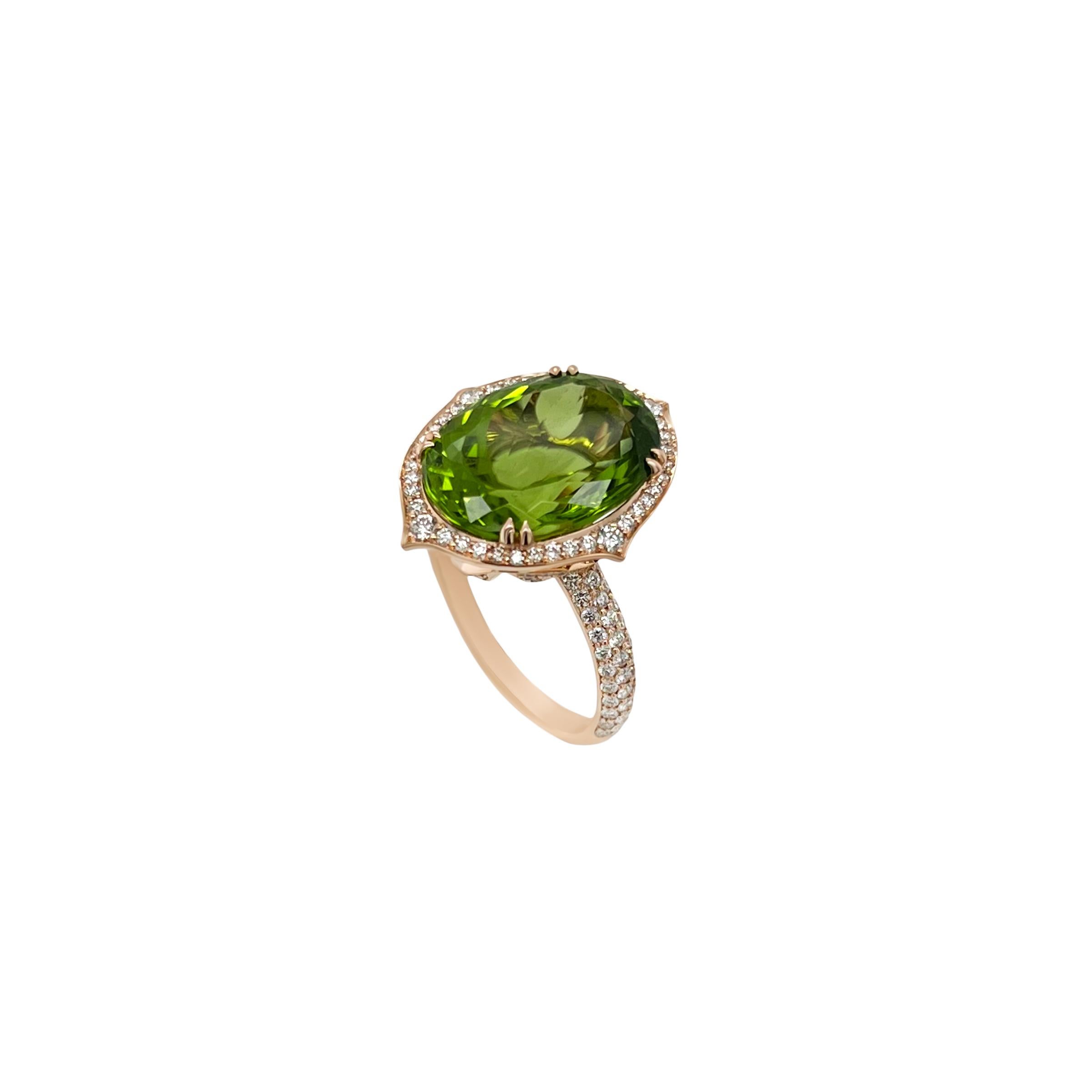A natural and eye clean 10.03ct Peridot is the star of this ring. The striking green is designed with a halo of diamonds featuring pointed edges. The under mounting of this ring was also designed intricately in a floral motif completed by a rounded