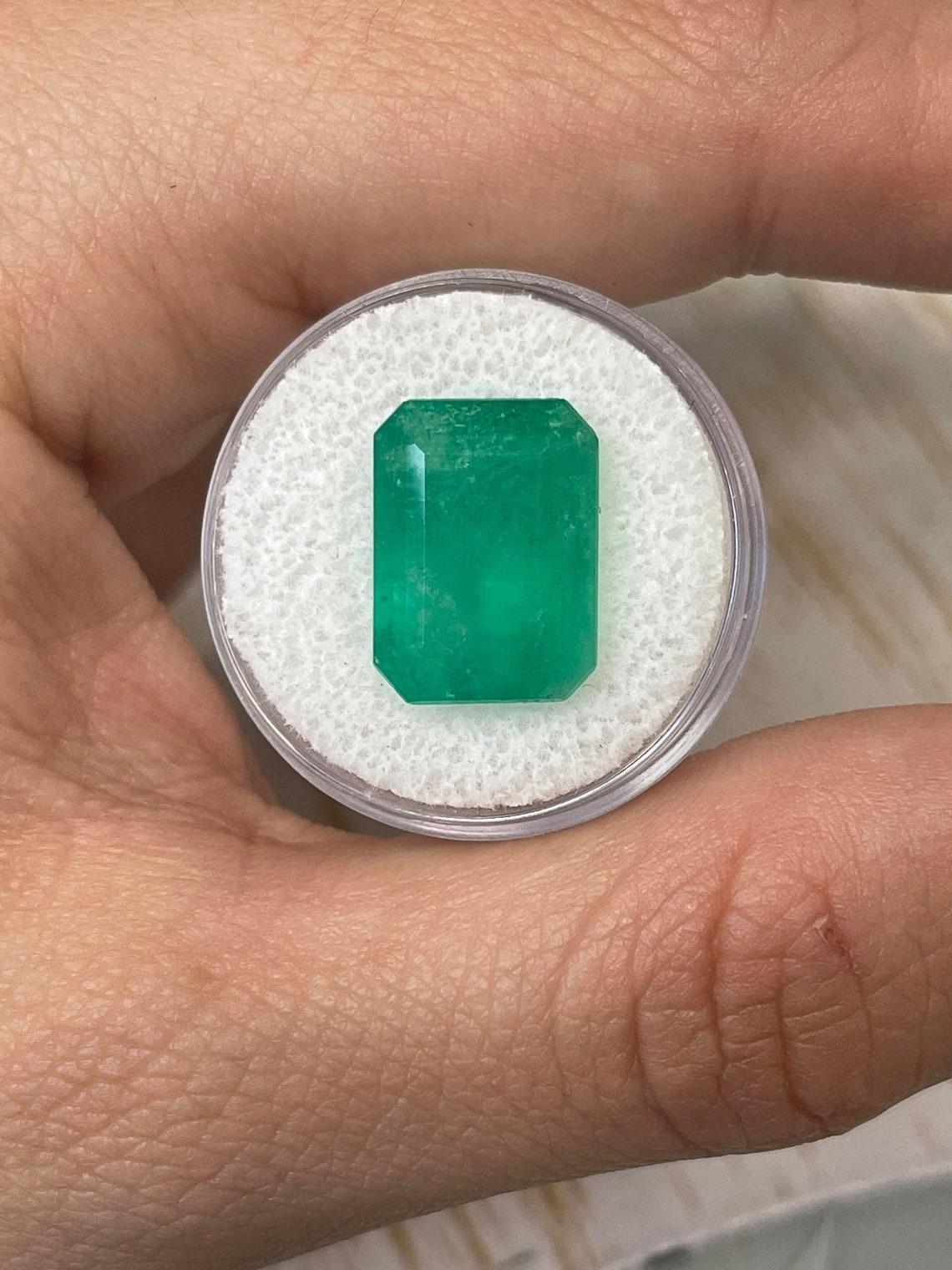 Stone: Emerald
Weight: 10.03-carats
Shape: Emerald Cut
Clarity: Transparent
Luster: Very Good
Color: Medium Green
Measurements: 15.49mm x 11.50mm x 8.25mm
Geographic Origin: Colombia
Treatment: Natural, Oiling

Comments: Due to their growth