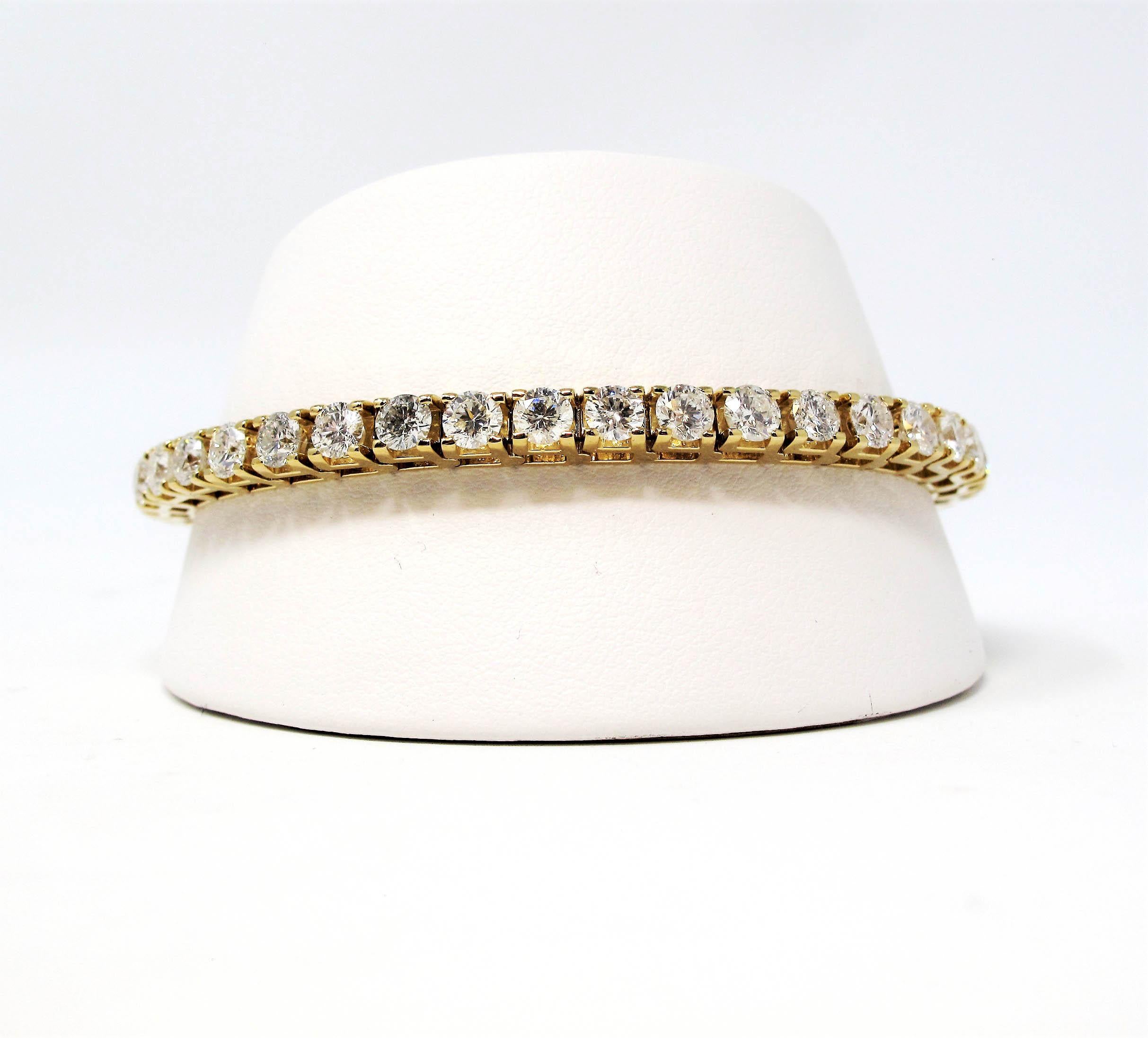 This is an absolutely stunning diamond tennis bracelet that will stand the test of time. The elegant yellow gold setting paired with the timeless round diamonds makes this piece a true classic that will never go out of style. 
   
This gorgeous