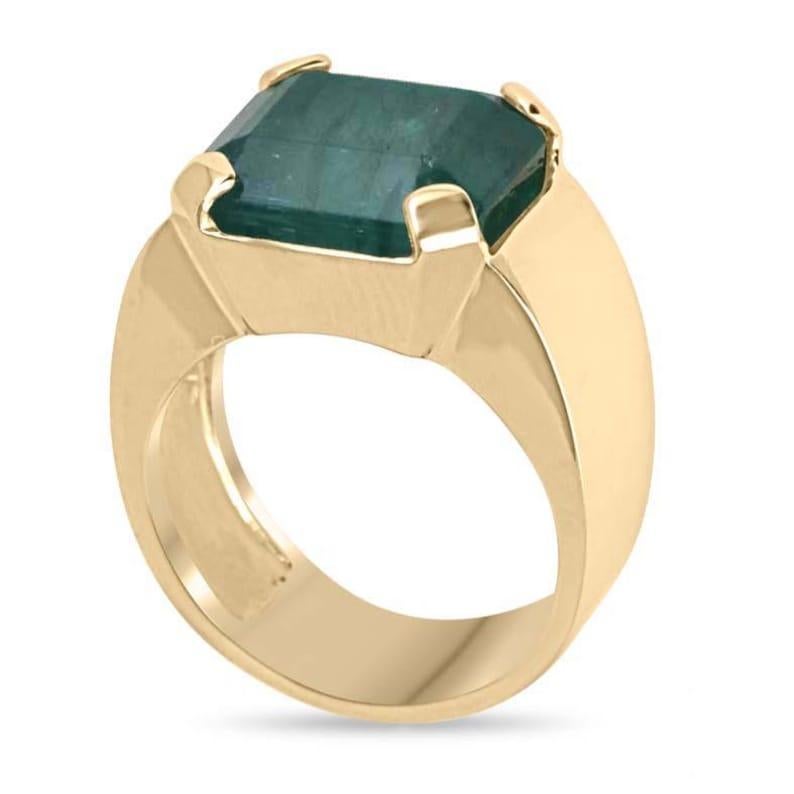 Introducing our striking men's emerald solitaire ring, showcasing a commanding 10.04-carat natural emerald cut emerald in a deep, captivating green. Set in an east-to-west orientation, the stone is securely held by bold, chunky prongs, creating a