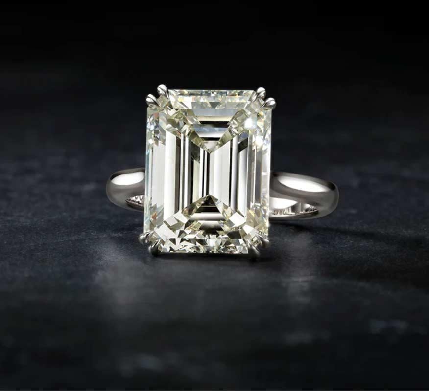 Introducing a stunning masterpiece of nature, a one-of-a-kind natural diamond ring that is sure to take your breath away. With a magnificent 10.05 carat emerald cut diamond, this ring boasts an unparalleled brilliance that captures the light with
