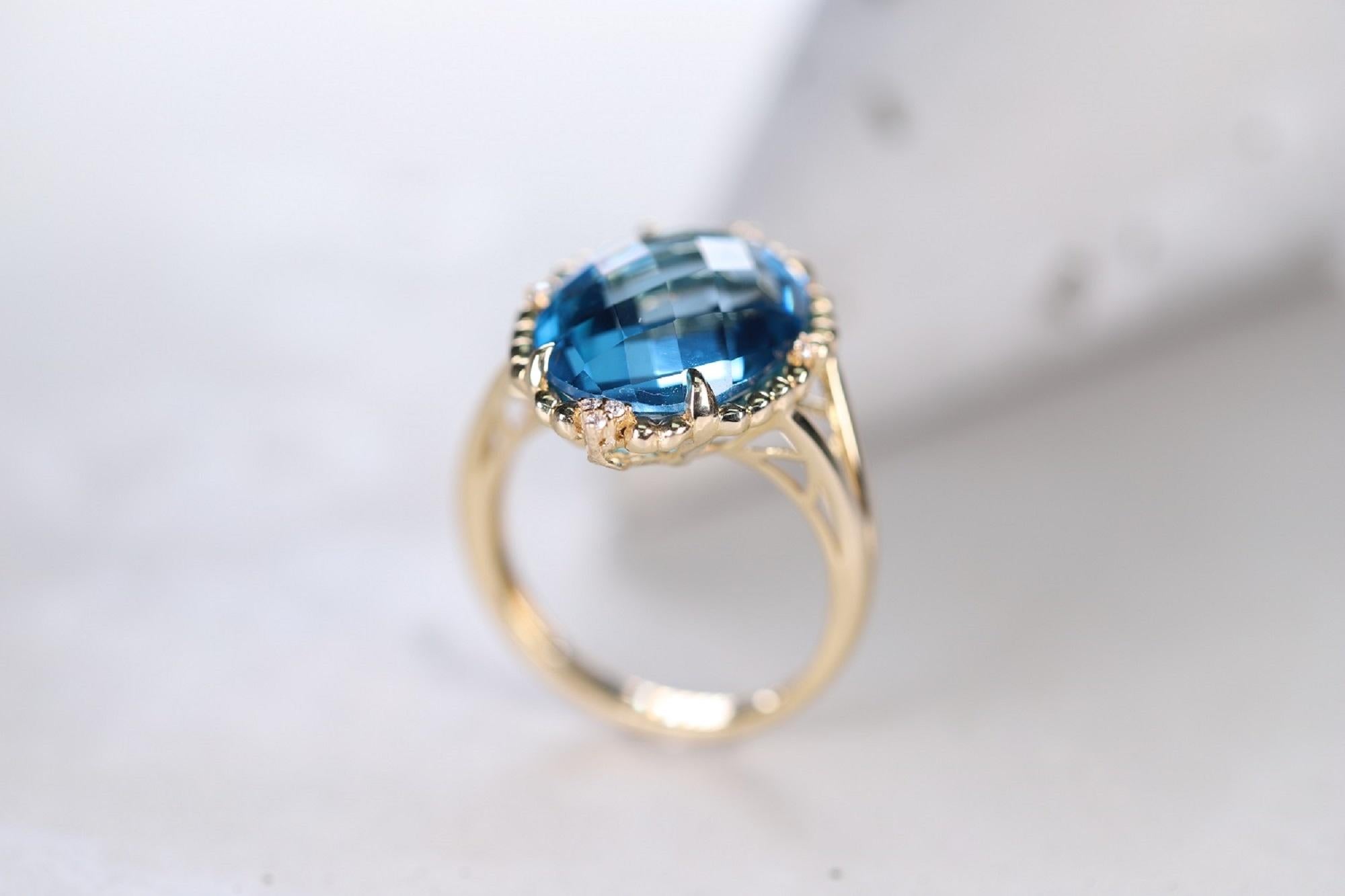Briolette Cut 10.05 Carat Swiss Blue Topaz and 0.03 Carat Diamond 14 Karat Yellow Gold Ring For Sale