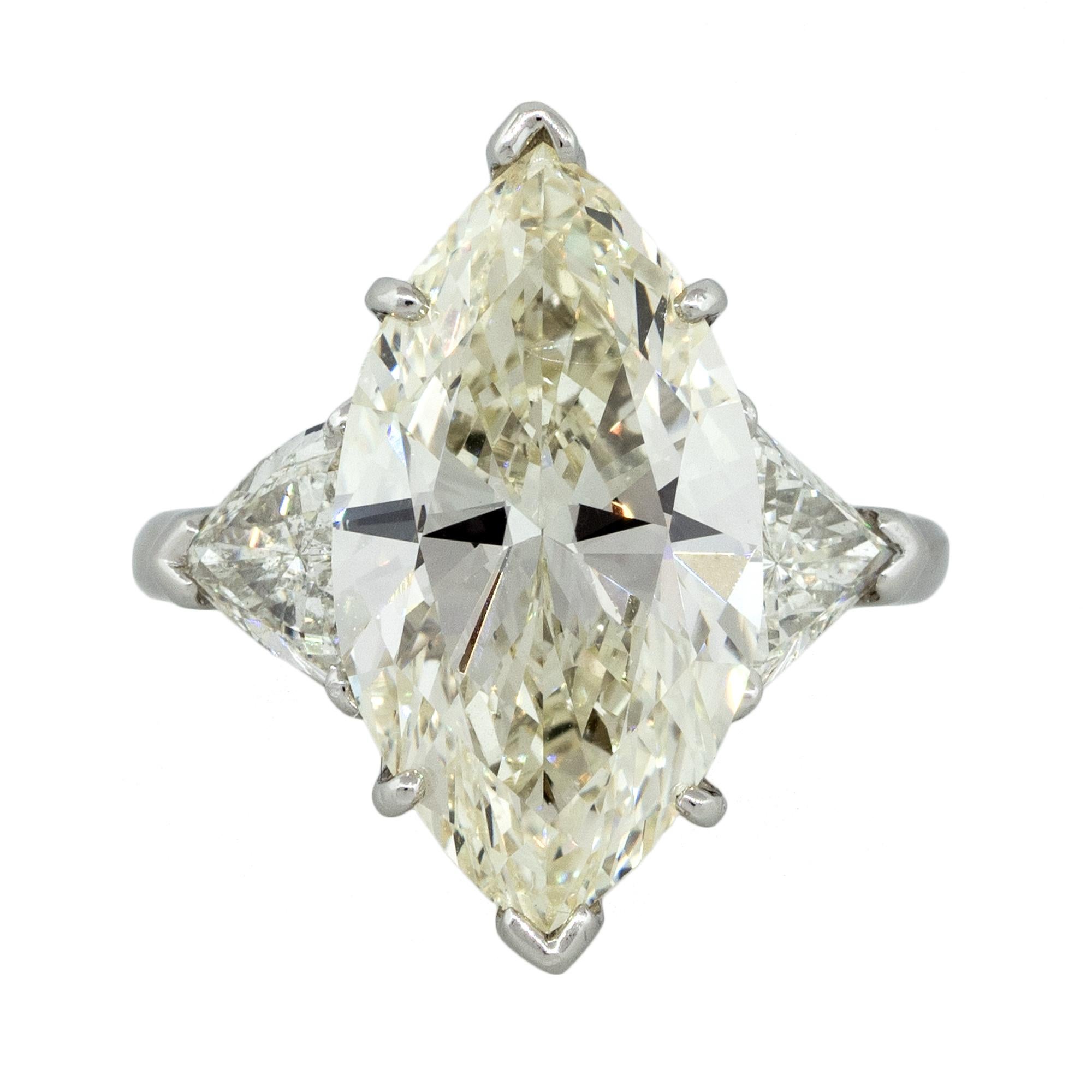 Main Diamond: Marquise Cut
GIA Report Number: 1152579414
Diamond Color: M
Diamond Clarity: SI1
Mounting Details: Platinum Setting With 2.00ctw of Trillion Cut Diamonds. Diamonds are H/I in Color and SI in Clarity
Mounting Size: Size 6.5 (Can be