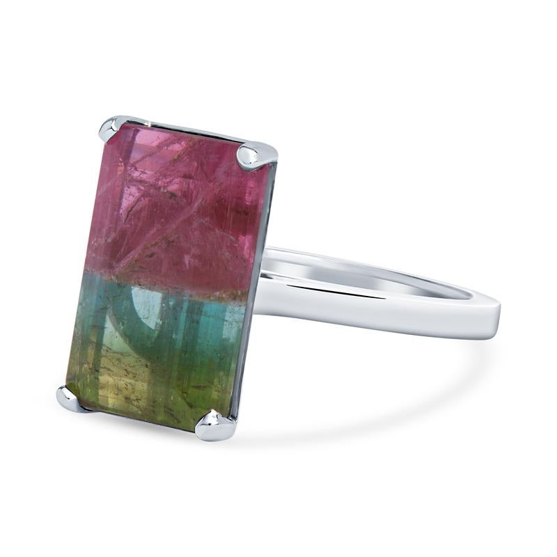 Tourmalines come in so may colors, hues and tones but to get one stone with multiple graduating colors is what makes this beauty so unique. This beautiful ring was custom made by our master jewelers and  features a 10.06 carat emerald cut watermelon