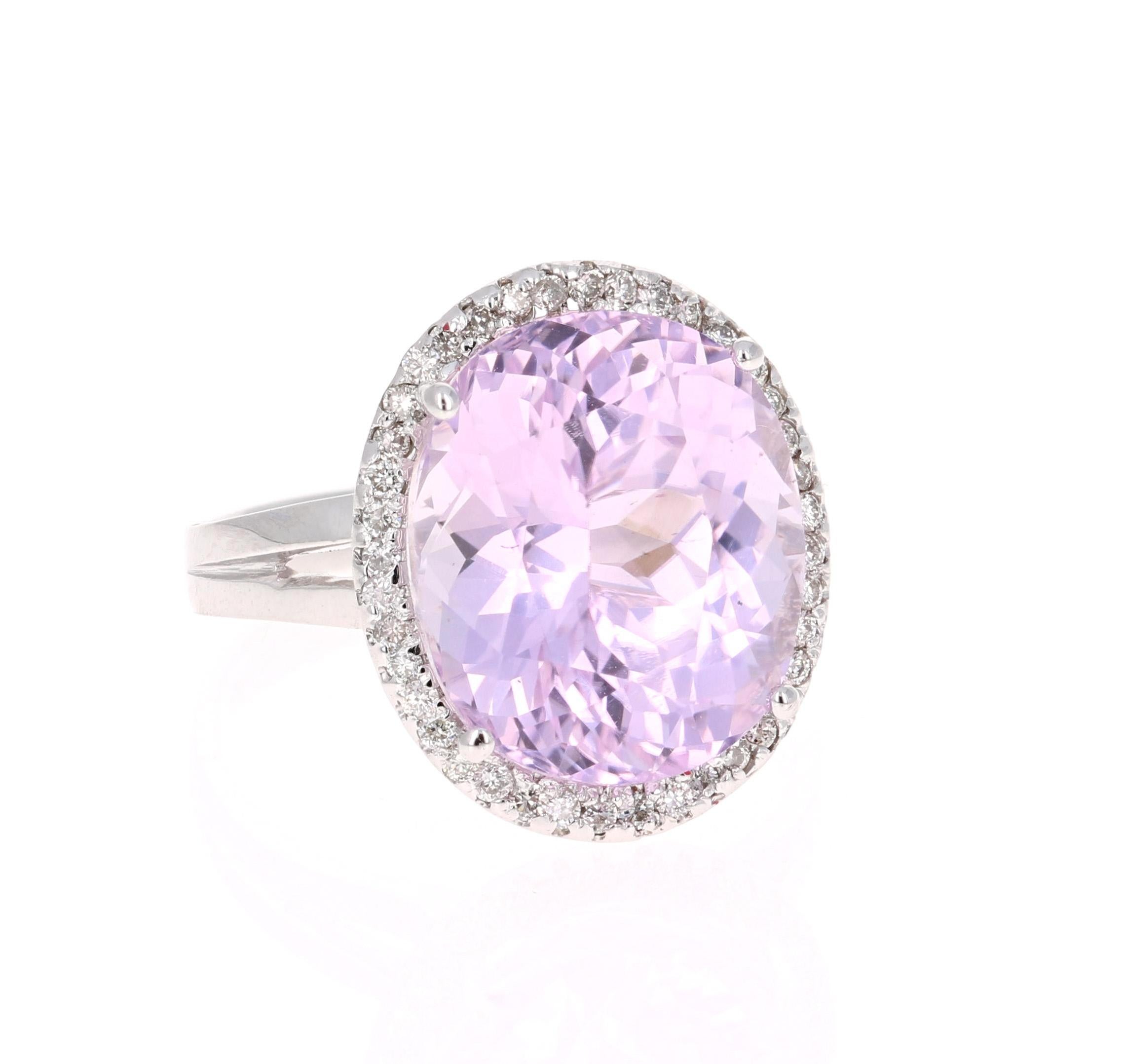 A lovely Engagement Ring Option or as an alternate to a Pink Diamond Ring! This simply stunning Kunzite Diamond Ring has a 9.80 Carat Oval Cut Kunzite as its center and has a beautiful simple halo of 40 Round Cut Diamonds that weigh 0.27 carats