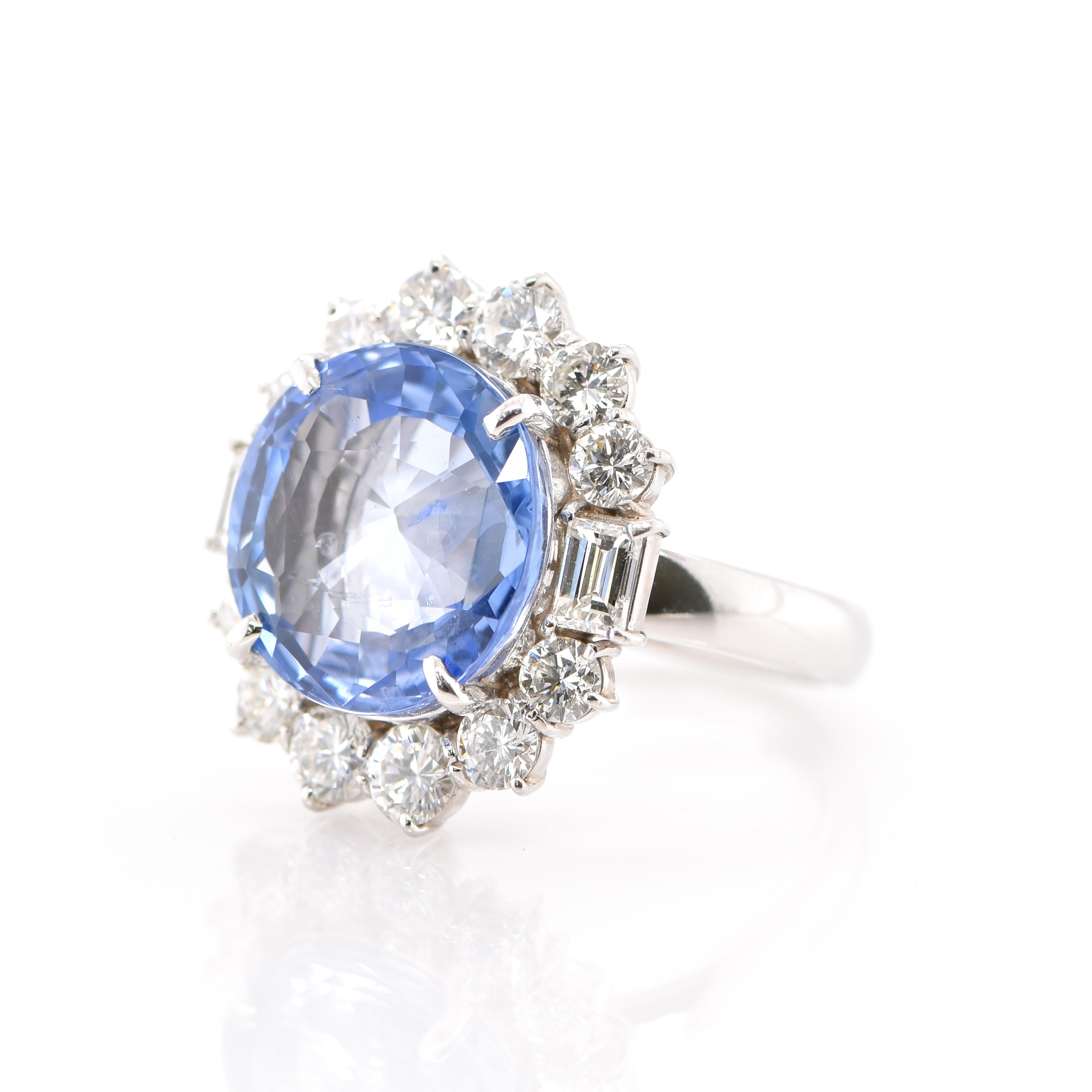 A stunning Halo Cocktail Ring featuring a CGL Certified 10.07 Carat Untreated, Natural Sapphire and 2.28 Carats of Diamond Accents set in Platinum. Sapphires have extraordinary durability - they excel in hardness as well as toughness and durability