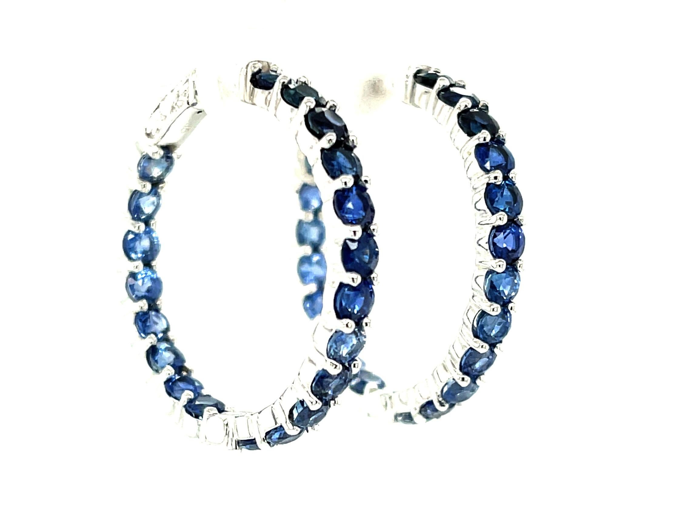 These eye-catching ombre blue sapphire earrings feature over 10 carats of fine blue sapphires set in 18k white gold! 