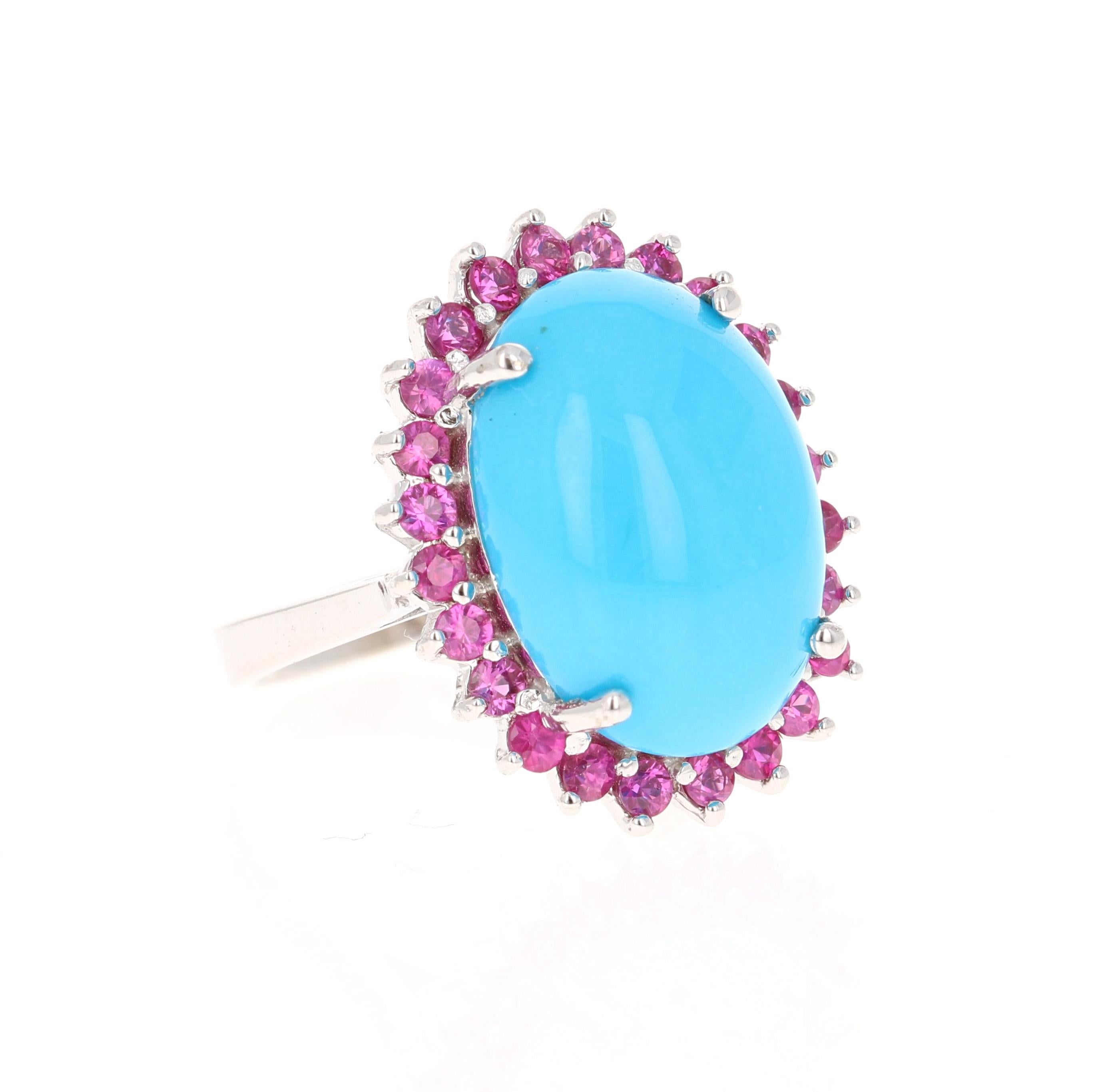 This gorgeous cocktail ring has a gorgeous Oval Cut Turquoise that weighs 9.05 carats embellished with 24 Round Cut Pink Sapphires that weigh 1.04 carats. The total carat weight of the ring is 10.09 carats. 

It is made in 14K White Gold and weighs