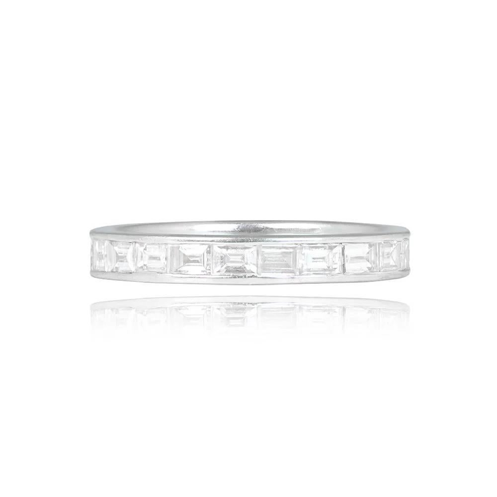 A diamond eternity band showcasing around 1.00 carats of channel-set baguette-cut diamonds in a handcrafted 18k white gold setting. The diamonds exhibit I color and SI1 clarity overall, with a bandwidth of 3mm.

Ring Size: 6.5 US, Resizable
Color: I