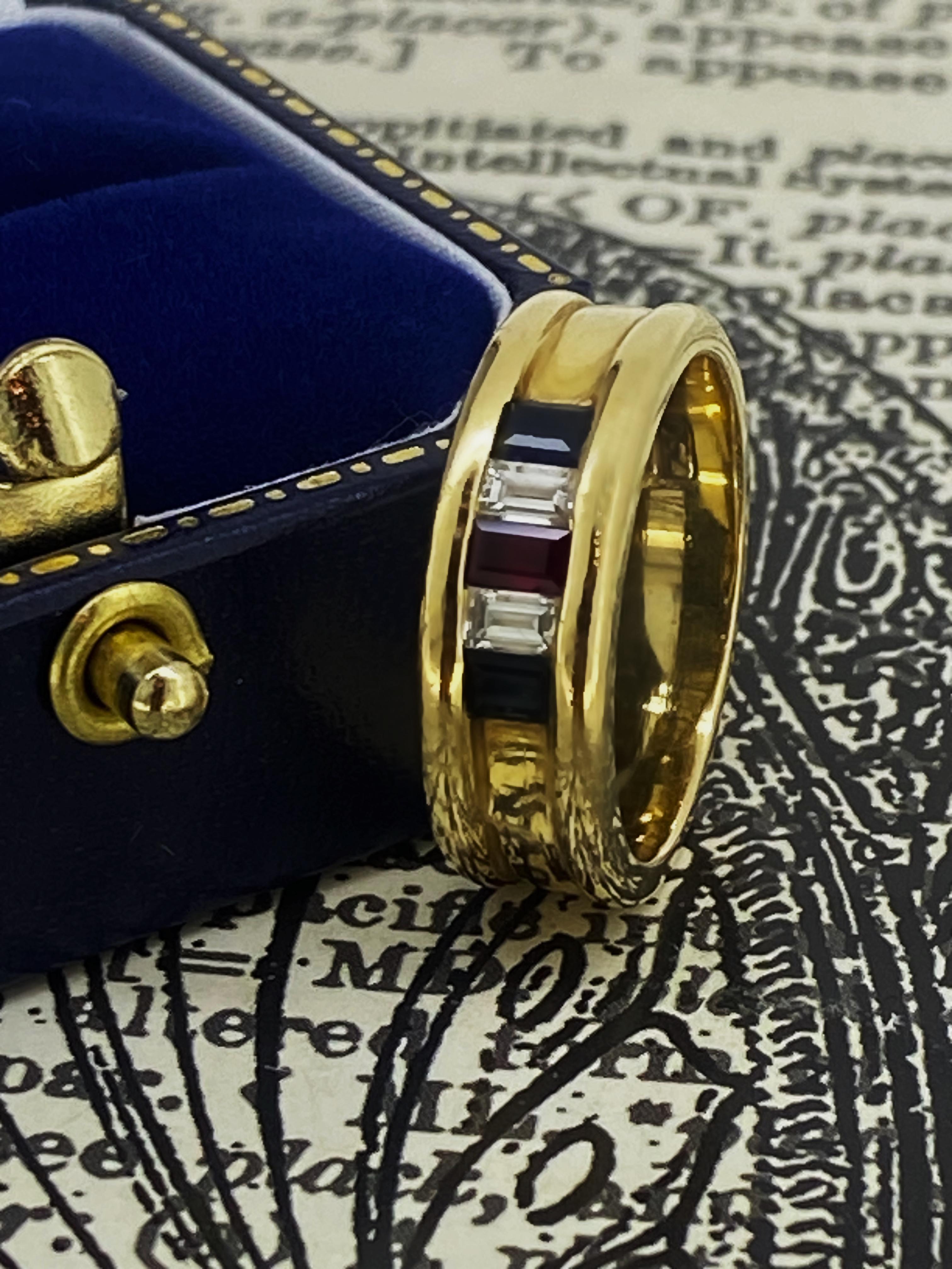 Of elegant, timeless & easy-to-wear design, 
this gem-set band is Retro, dating back to 1970's 

Channel-set with 5 Natural Gemstones
of elegant & quite desirable baguette cut: 

Centrally set with a Ruby of vibrant “pigeon blood” colour
of 0.20ct