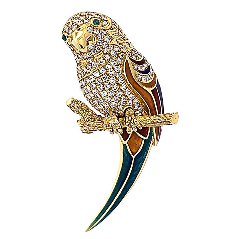 This is a gorgeous 18k yellow gold enamel bird pin. The pin is set with sparkling round cut diamonds that weigh approximately 1.00ct. The color of these diamonds is E-F with VS clarity. The diamonds are accentuated by cabochon cut emerald accents.