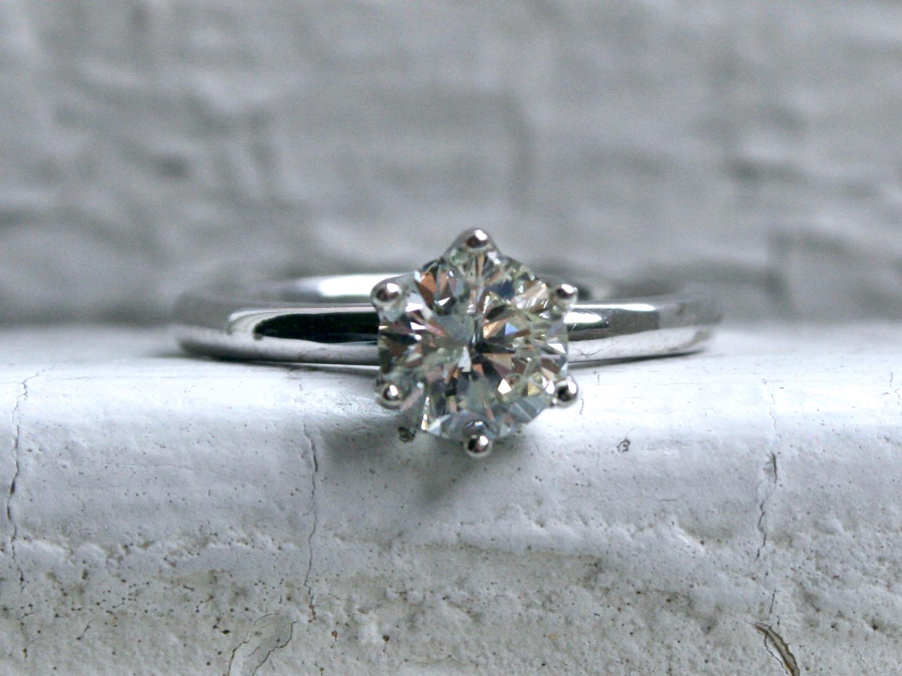 Simple, Elegant, Sparkly! This Beautiful Solitaire holds a Round Brilliant Cut Diamond, 1.00ct in weight, of I/SI3 quality, set in our signature stunning Six Prong Tulip Setting. 

Other Important Details: 
Size 6. 
The ring is stamped '14K'.
The