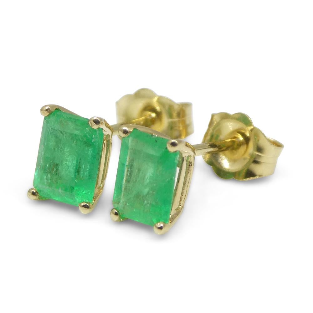 Contemporary 1.00ct Emerald Cut Green Emerald Stud Earrings set in 14k Yellow Gold For Sale