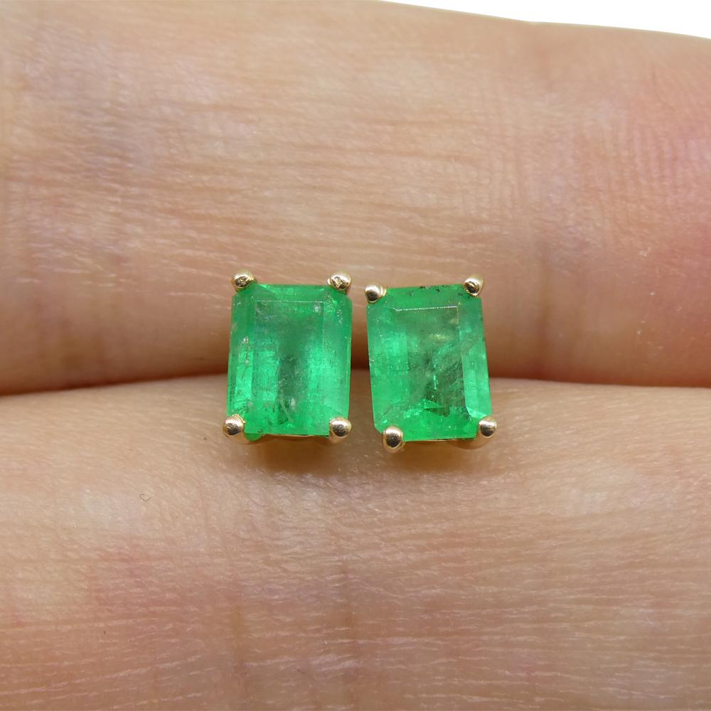 Women's or Men's 1.00ct Emerald Cut Green Emerald Stud Earrings set in 14k Yellow Gold For Sale