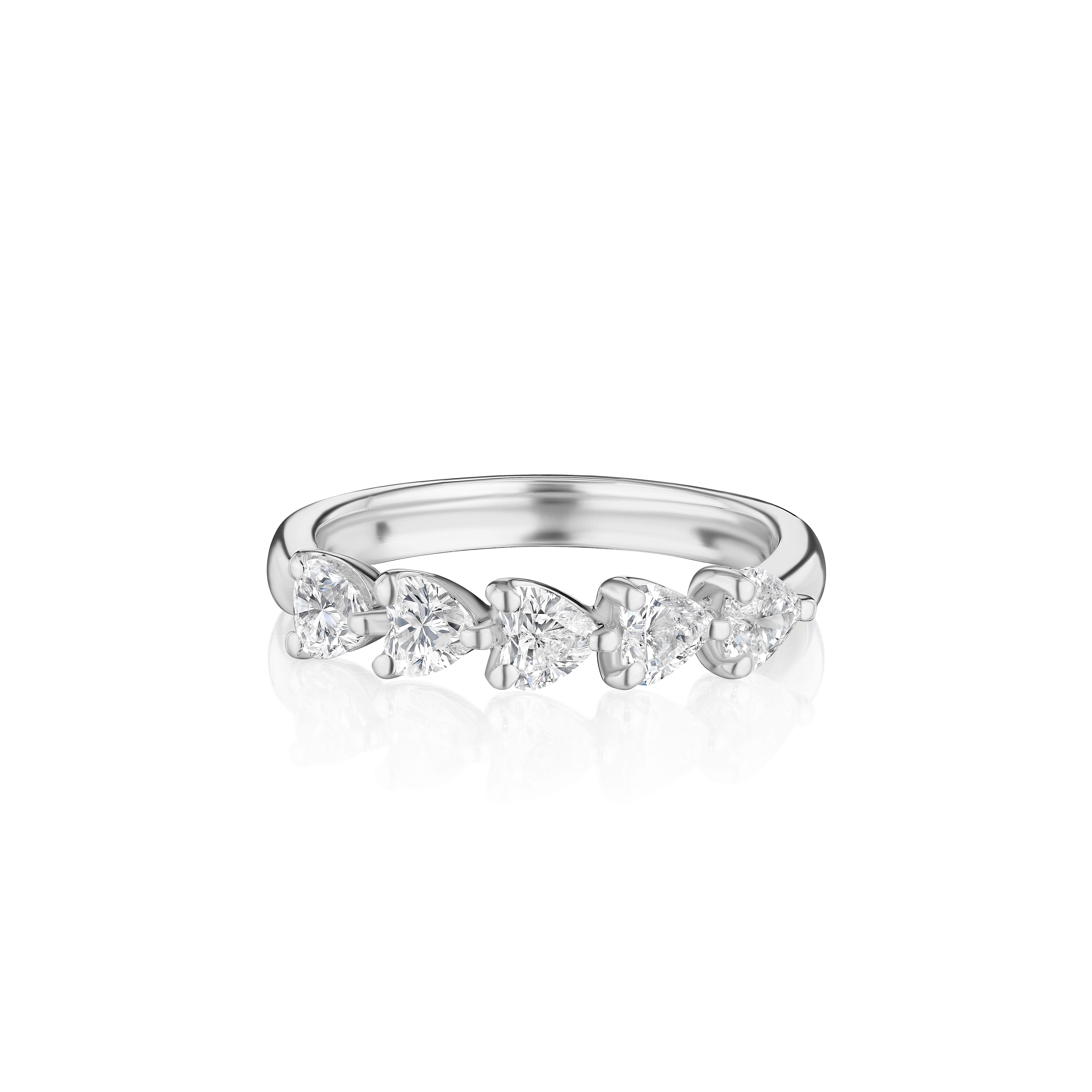 Crafted in 18KT gold, this band is made with 5 heart shape diamonds which encircle the finger, and has a combining total weight of approximately 1.00 carat. The diamonds are set east to west in a shared prong setting. Worn beautifully on its own or