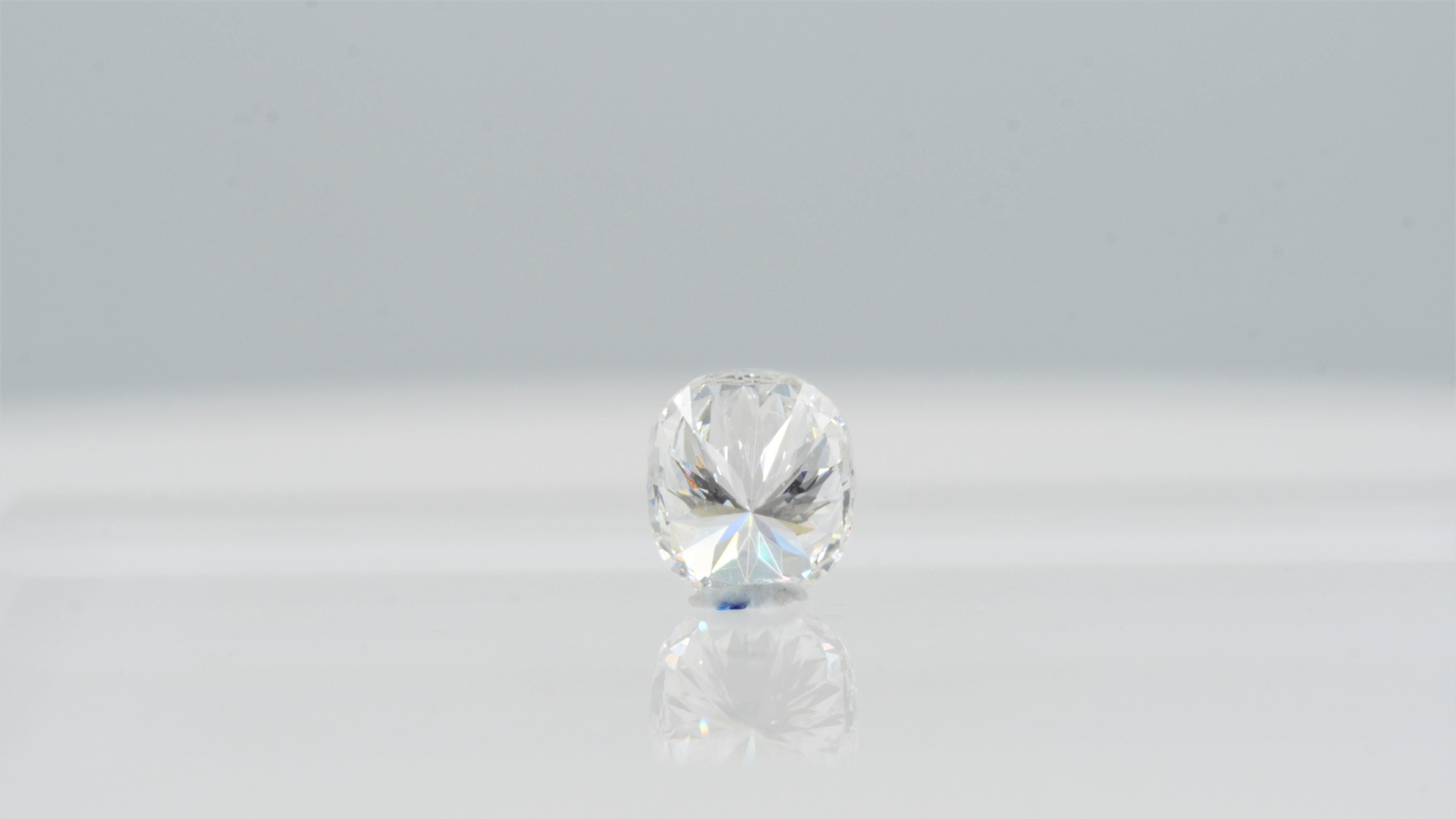 Brilliant 1.00ct loose cushion modified brilliant-cut diamond that's been GIA certified. The color is H with a faint fluorescence which brightens and whitens the diamond. The diamond has nice brilliance and it's VS2 in clarity, so there are no