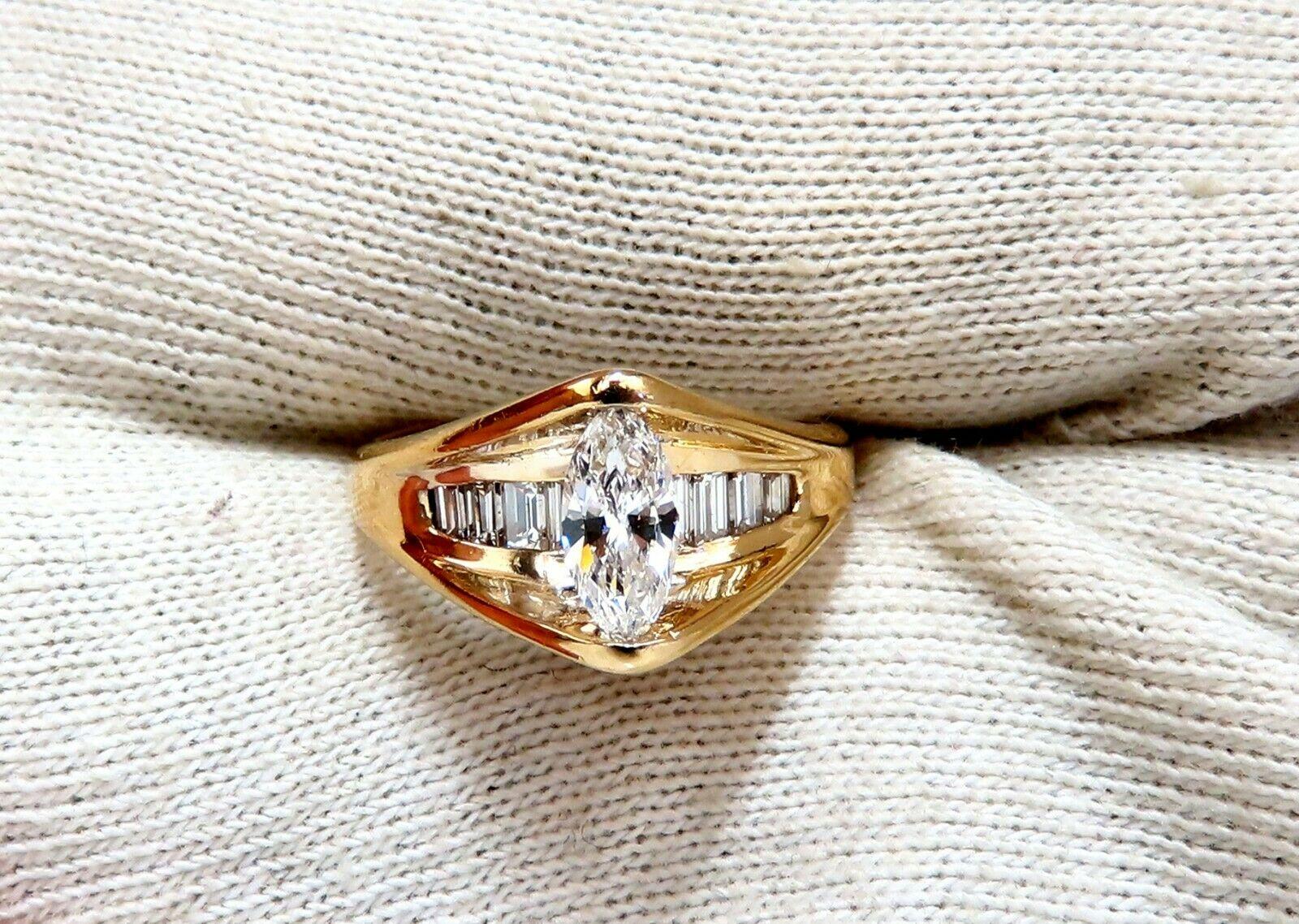 Marquise Bypass Raised Mod.

.50ct. Natural Marquise diamond Ring

H-color, Vs-2 clarity

6.9 x 3.9mm

.50ct Baguette cut diamonds

G-color vs-2 clarity

14kt. yellow gold. 

5.2 grams.

Ring is 10.3mm wide

Depth: 7mm

current ring size: 7

Free