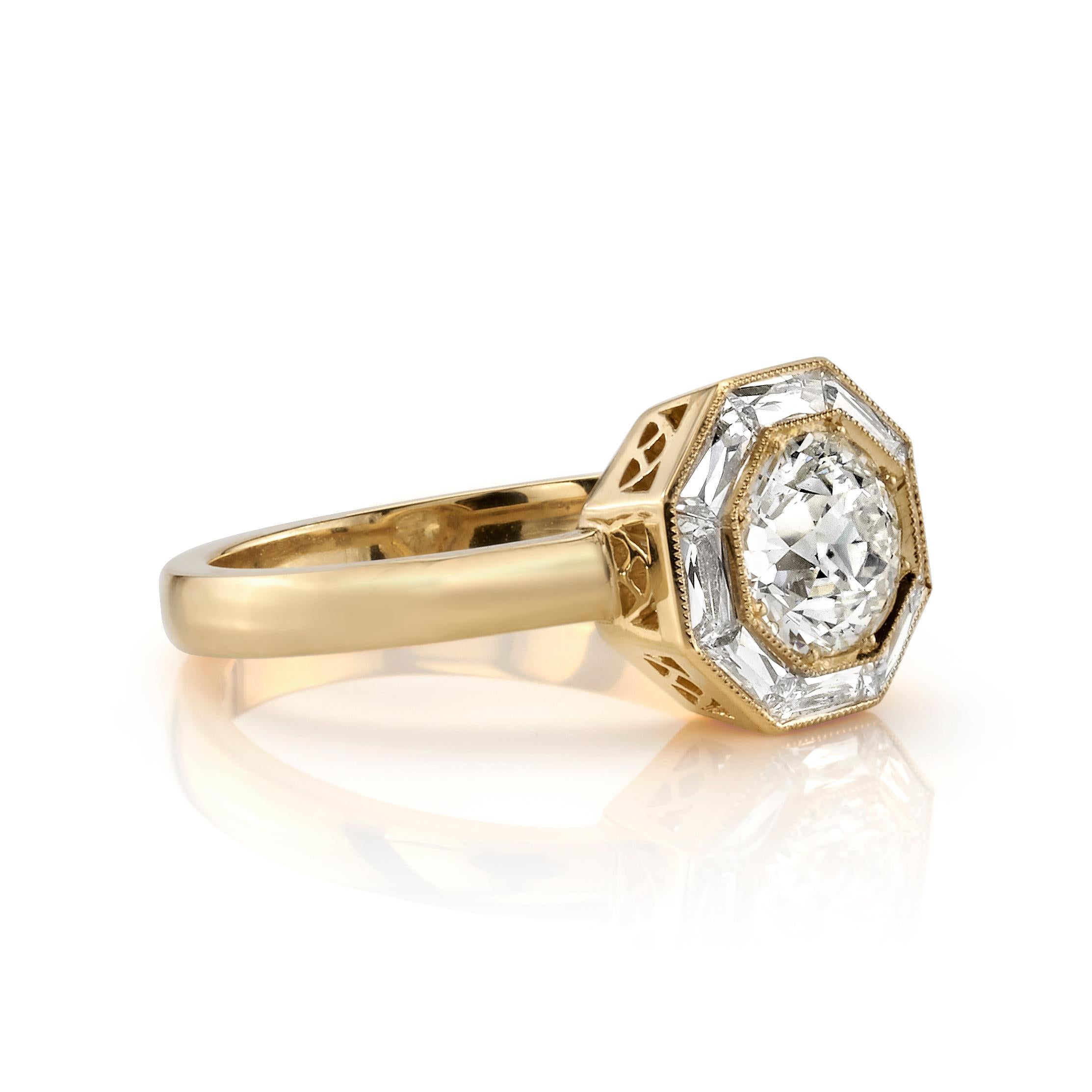 1.00ct K/SI1 GIA certified old European cut diamond with 0.46ctw french cut accent stones set in a handcrafted 18K yellow gold halo mounting. Ring is currently a size 6 and can be sized to fit.
 