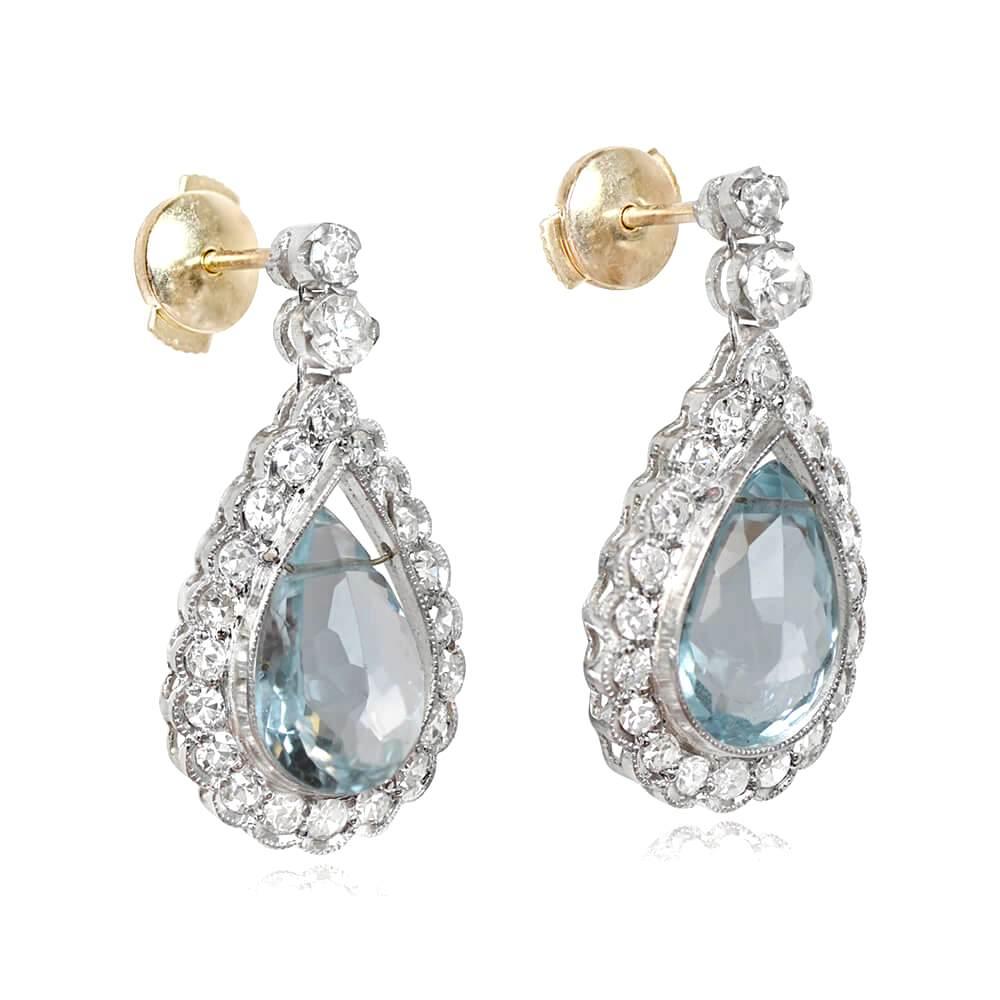 Embrace the serene beauty of these elegant earrings, adorned with pear-shaped aquamarines and shimmering diamonds. Each earring showcases a mesmerizing pear-shaped aquamarine weighing approximately 1.00 carat, exuding a tranquil blue hue that